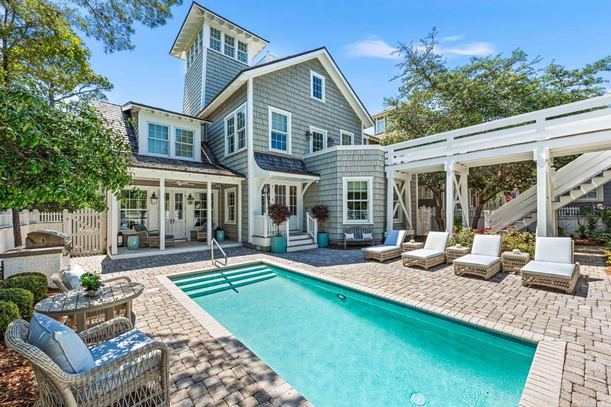 Welcome to an architectural masterpiece by renowned architect Peter Block, where luxury living meets seaside sophistication at this one-of-a-kind Nantucket inspired residence. Nestled in the coveted community of WaterSound Beach, this exquisite residence features a 5BR/6.5BA primary home, 1BR/1BA carriage home, private outdoor oasis with oversized swimming pool and deck, elevator, and unobstructed, majestic views of the Gulf of Mexico. Step inside to discover a harmonious fusion of exquisite design and impeccable craftsmanship. Every detail of this home has been thoughtfully curated, from the wood floors to the shiplap walls and ceilings, evoking a sense of timeless coastal elegance. The main house offers a reverse floor plan with a spacious media room, a lovely primary suite, and two additional guest rooms with ensuite bathrooms. On the second level, enjoy an expansive great room with fireplace, a perfectly appointed commercial-grade kitchen with Sub-Zero, Wolf, Bosch, and Scotsman appliances, a light-filled dining area, charming guest bedroom with ensuite, and a dedicated office. Ascend to the third level to find another living area, a convenient beverage center with sink and built in Sub-Zero fridge and Fisher & Paykel dishwasher, a bunk room with three built-in bunks and two trundle beds, and a full bathroom. The fourth level viewing tower features a gathering space to enjoy the most spectacular dune and Gulf of Mexico views.

Designed to embrace its stunning surroundings, the floor plan seamlessly flows from indoor to outdoor spaces, offering panoramic views of the majestic Gulf waters and the picturesque WaterSound Beach. Relax and unwind in the luxurious courtyard oasis, complete with a heated pool and outdoor gas firepit, perfect for entertaining or enjoying tranquil evenings under the stars. Connected via a second-level walkway or its own private exterior staircase, the carriage house offers additional living space and a full kitchen, situated above the two-car and one golf cart garage. This remarkable retreat is a must-see for the discerning buyer seeking the ultimate blend of serenity, style, and coastal charm.

The gated WaterSound Beach community is located south of Scenic Highway 30A offering homeowners a rare sense of seclusion yet with easy access to area activities. Amenities include swimming pools, a puttering park, community green spaces, a state-of-the-art fitness center, and private boardwalks to one of the most beautiful miles stretches of coastline in the area.