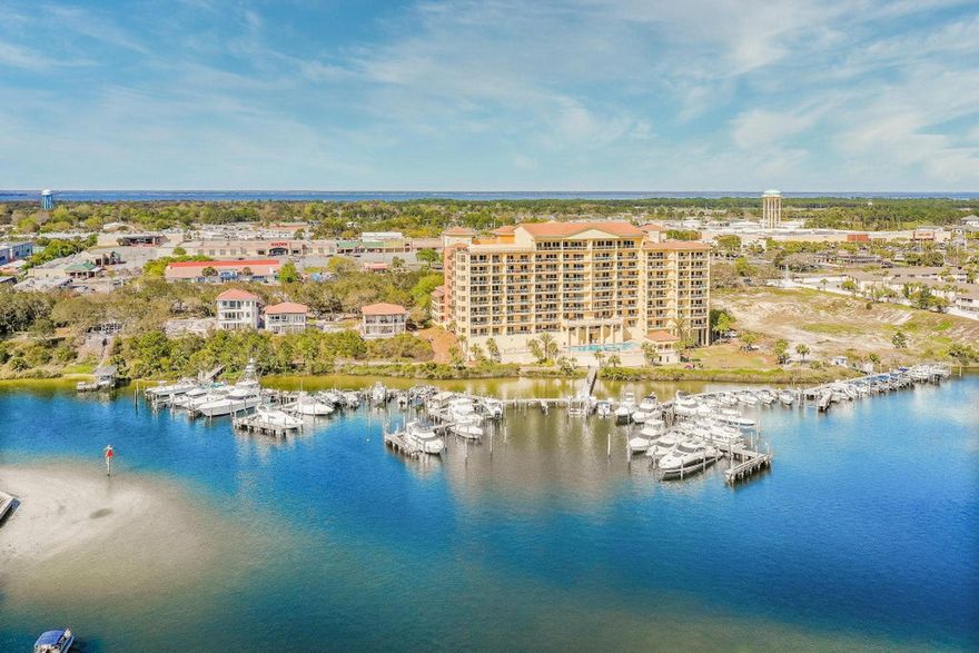 Amazing condo on Destin Harbor.  Offering beautiful views of the harbor and the Gulf of Mexico. This condo offers a large patio with summer kitchen that is the perfect spot for a picturesque sunset dinner. Also featuring four bedrooms and four baths, large kitchen and dining area with a spacious living room.  Comes fully furnished with a few exceptions.  Two garage parking spaces included. This is an owner only building. Prestigious community room, pool and hot tub add to your convenience. The perfect place to call home !