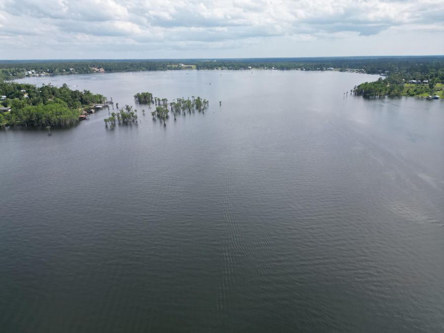 BACK ON MARKET AT NO FAULT TO SELLER AND LAND .....Large 2.72 acre corner lot in Compass Lake in the Hills. There is a voluntary HOA of $135 a year, but what a great price for all the amenities that are included such as: access to 2 lakes for fishing, tennis, horse stables / riding, rental cabins, RV spots, boat rentals, clubhouse, and a  golf range.  Being an all-sports lake, enjoy water skiing, tubing, jet skiing, boating, sailing, kayaking & swimming. No need to worry about lunch while out on the water when you have a boat accessible shoreline restaurant.  This location is great for someone who enjoys nature and a short drive to the beach since it is located half way between Panama City And Dothan. The area is rich in historical significance, with many restored antebellum plantation homes open for tours or as bed-and-breakfast