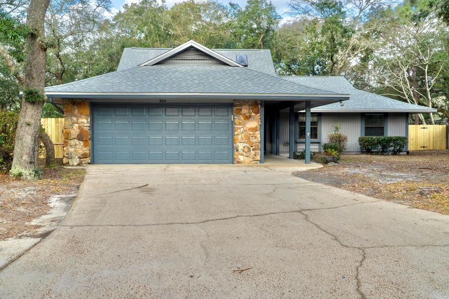 This spacious Fort Walton Beach home located the Berkshire Woods subdivision has much to offer. The living room features tall cathedral ceilings with a brick fireplace and offers an array of natural light from the skylights and several windows, with a closet under the stairs for even more storage. The spacious upstairs loft is a fun feature that could be utilized in many different ways with a window that overlooks the backyard.  The kitchen has stainless steel appliances, an island with stovetop, a great amount of counter and cabinet space, bay windows, a pantry, and a spacious walk-in closet under the staircase that could be used for more pantry space. This home also offers a very spacious and fully fenced backyard with a double gate. New roof installed in 2021.
