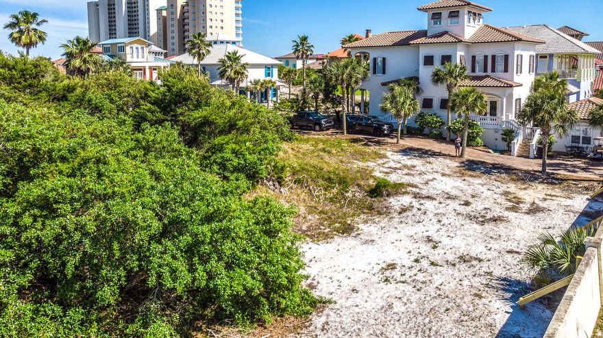 Discover an exceptional location for your new beach home in this generously sized home site in Caribe. Is privacy important to you? Caribe is secured from the hustle and bustle of Miramar Beach by a locked gate. The road winds down to a private beach, accessible only to those privileged to bask in Caribe's quiet island style elegance. Architectural details of the cloistered neighborhood's homes underscores the festive yet relaxed way of life long cherished on all the best beaches. Don't be fooled by this lot's very reasonable price. It is only about 5 lots from the pure-white sandy beach; a few steps farther to the neighbors-only pool; and the non-public tennis court. Included with the price of this home site are conceptual plans for a breathtaking home. Don't miss this rare opportunity