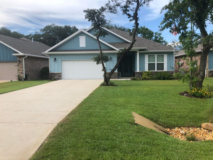 This beautiful home is centrally located in Shalimar perfect for a growing family. Home was built in 2018 it features 10' ceilings, wood like tile in all areas except the bedrooms. Kitchen features stainless steel appliances, granite countertops, custom cabinets, an oversized island, double ovens and gas cook top. As you enter home through foyer there's a guest bedroom and a bath at the front of home. Dining room and family room are spacious. Two bedrooms located at end of the house that share a bathroom. The master bedroom is spacious and the master bathroom features double sink vanities, walk-in tile shower, a bathtub and a walk in closet. Home has a great backyard and includes a good sized Lanai perfect for entertaining.