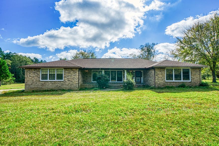 Country Living At It's Best!  Spacious Brick Home with Screened Porch Facing the Wooded Area of the Property.  Perfect for Morning Coffee or Afternoon Sunsets.  Large Rooms Throughout.. Including a Family Room with a Wood Burning Fireplace.  Kitchen has a Breakfast Nook, Extra Cabinet Storage, Plus a Pantry.  Whole House Generator Included.  Tons of Room For Horses, Chicken, Gardening and More!