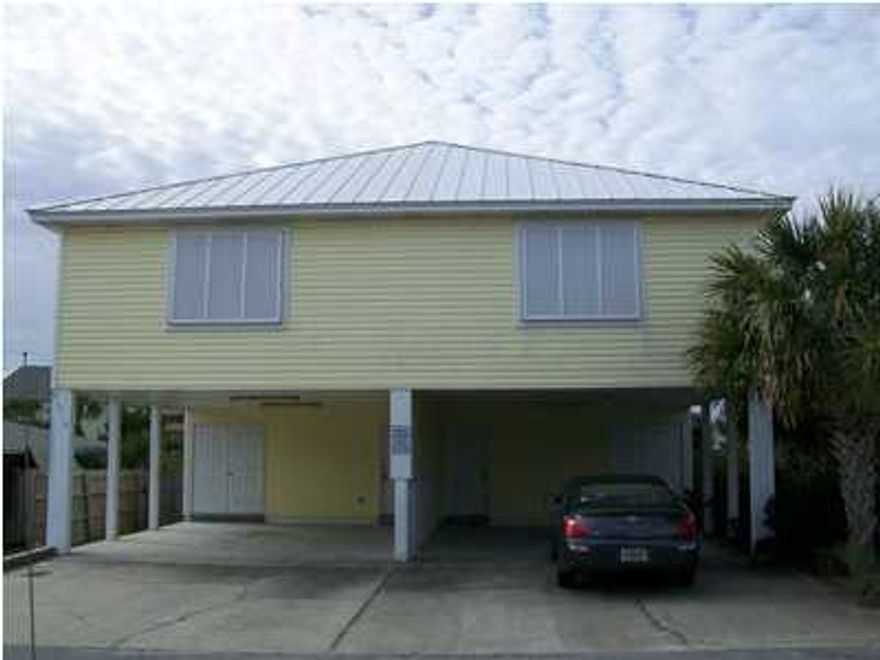 This furnished two bedroom, two bathroom duplex is located just minutes away from the beach. You can even catch a glimpse of the ocean from the back porch of this two story rental home in Panama City Beach. You'll enjoy the features of this home including tile in the main living areas and carpet in the bedrooms. The first floor boasts one bedroom and one bathrooms with the remaining bedroom and bathroom located upstairs. Pets are negotiable. There is covered parking for two cars. Washer and dryer included. There is no access to the pool that is connected to the property behind this duplex. You do not have access to the back stairs.