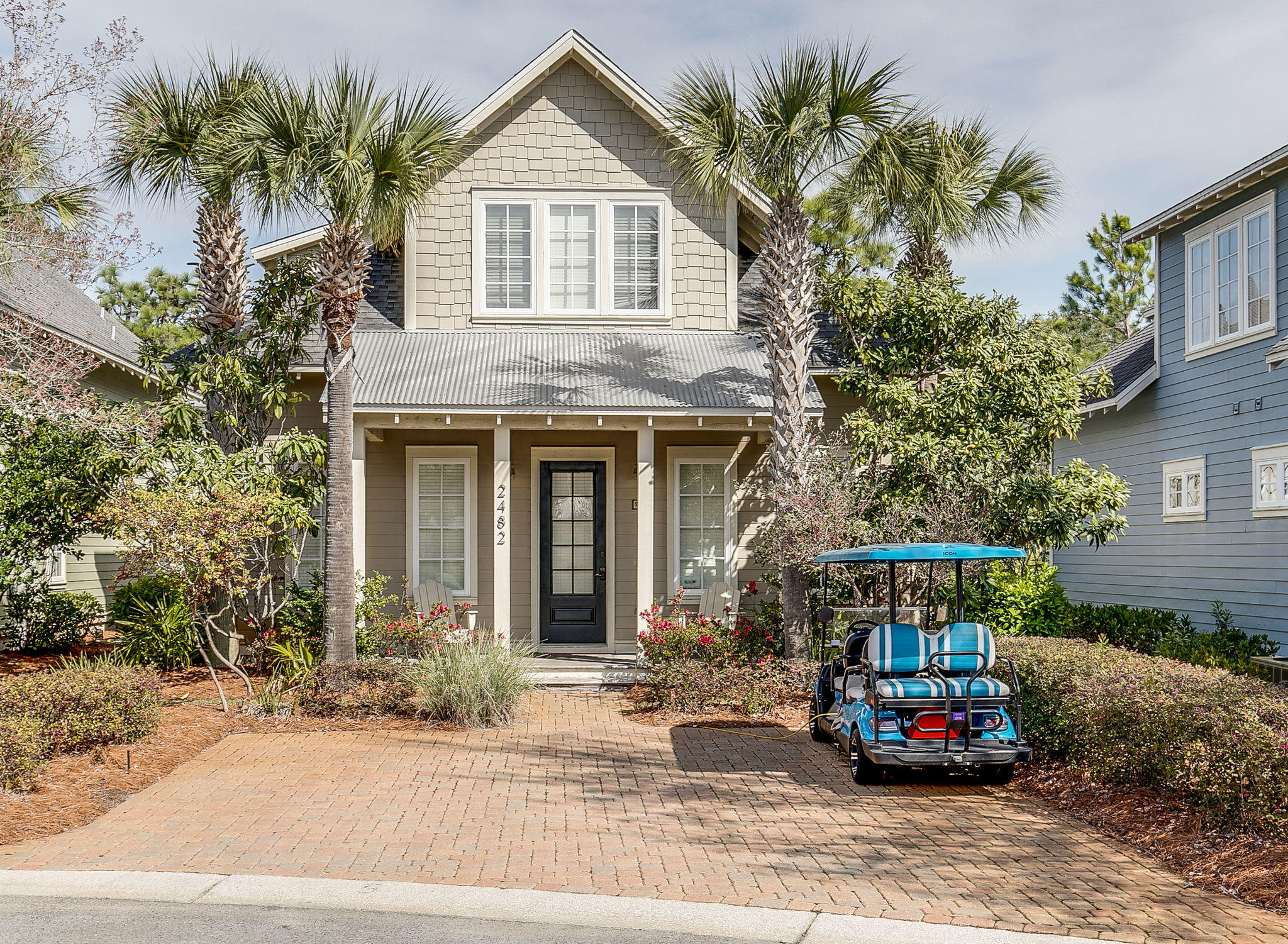 This charming Florida cottage welcomes you with its rocking chair front porch and a brick pavered driveway that easily accommodates two cars plus a golf cart! This delightful plan offers travertine tile flooring, crown molding and wainscoting throughout the first floor common areas. Nicely furnished with a large living room that provides ample space to relax and unwind as well as a fully equipped kitchen with granite counter tops, stainless steel appliances, custom cabinets, and full size pantry. The first floor master bedroom offers a king size bed with en suite bathroom including a double vanity, large walk-in shower, and walk-in closet. You will also find a bunk room, laundry room and additional bath on the first floor. Upstairs offers plenty of room for guests with