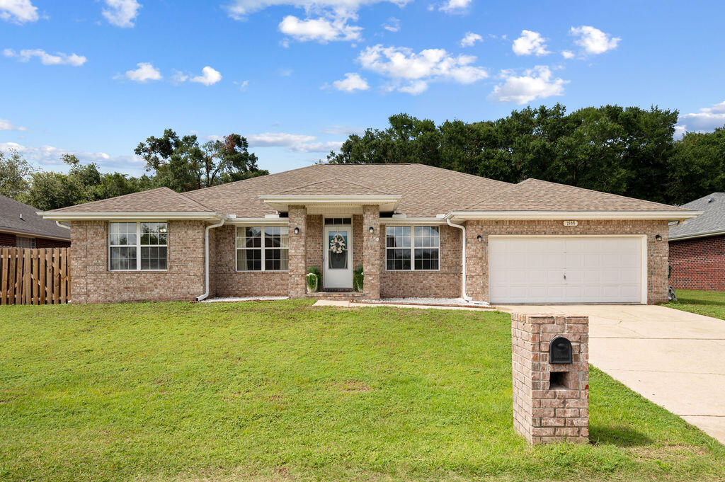 Welcome to 2168 Hagood Loop! This beautifully updated 4-bedroom, 2-bathroom home is being offered with an ASSUMABLE VA 3% INTEREST RATE LOAN and features brand new luxury vinyl plank (LVP) flooring throughout, offering a modern and durable finish. Enjoy the spacious screened-in patio overlooking a large backyard, perfect for outdoor activities and relaxation. The home also boasts new lighting fixtures both inside and out, enhancing the ambiance and functionality of every room. A modern, new barn door elegantly closes off the office space, providing both privacy and style. Every room is filled with abundant natural light, creating a warm and inviting atmosphere.