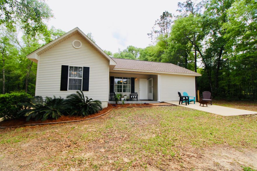 Beautiful completely remodeled home sitting on a double wide lot that offers privacy and country living at its best. New Roof, New HVAC and new water heater installed in 2019, wait until you see the interior finishes. You will love the open floor plan, split bedrooms and luxury vinyl flooring. Carpet in all the bedrooms.  Completely remodeled kitchen and stainless steel appliances. There is a bonus 2-story detached unfinished 1800 sq feet garage which would be any craftsman's dream. You could use a garage or workshop. RV amp hookup. The upper floor could be finished and turn it into a mother-in law suite. Great central location. 45 minutes to 30A, PCB and Crestview. Just about 10 minutes to Defuniak Springs. Just minutes to the springs in Ponce de Leon State Park.