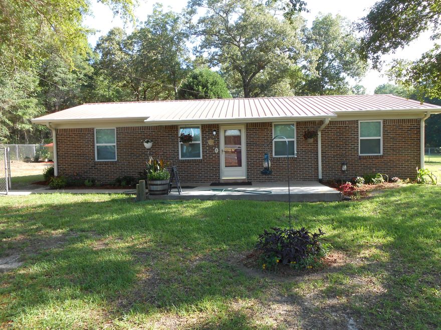 Looking for a quaint home on 2 acres in a quite area? This home is for you. Low maintenance all brick home offering fresh new paint in all the rooms, new ceiling fans, new electric outlets and covers as well as all new Windows that were installed in 2013. This 3 bedroom 1 and half bath home has tons to offer to include an additional septic tank located on property that could be used for an RV or mobile home. A detached 16x16 workshop with concrete floor that makes for a perfect workshop. The front and back yard is chain link fenced, nice landscape and flowers in front yard and tall oaks make this feel like home. Close to Vortex, Morrison and Ponce de Leon Springs and just a short drive, to the beaches of Panama City or Destin FL. Make an appointment today to see this move in ready home!