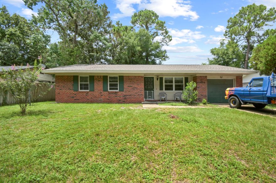 DIAMOND IN THE ROUGH! 3 bed/2 bath brick home WITH A GARAGE - perfect for investors to fix and flip, or for a handy homeowner to have instant equity. Big ticket items are taken care of - Roof 2023, Water Heater 2018, and HVAC 2019 - cosmetic work only! Don't let the size fool you, this home makes perfect use of every square foot! Stepping inside you are immediately welcomed to the living room, perfectly sized for large families or entertaining guests. Continuing on to the kitchen there's an abundance of storage and room for a dining table overlooking the screened patio. Notice Tile/LVP flooring - NO CARPET THROUGHOUT! The two guest bedrooms can both accommodate a queen bed and share a bathroom in the hallway with an updated vanity. The master bedroom can fit a king bed and has a private en-suite bathroom with a walk-in shower. The crown jewel of this property is the SCREENED PATIO, perfect for enjoying a cup of coffee in the morning without the famous Florida wildlife bothering you! The spacious yard is fully fenced and perfect for whatever projects you have in mind. The Corrydale neighborhood is very popular being located directly next door to Naval Hospital Pensacola and within close proximity to downtown and the sugar white beaches of Perdido Key and Pensacola Beach.