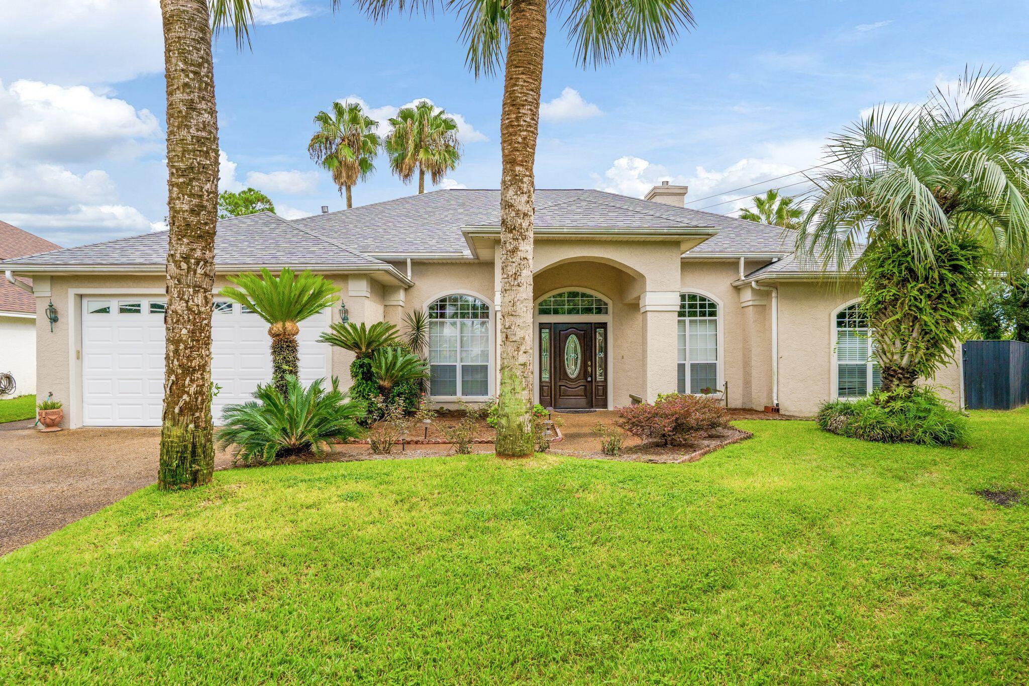 This immaculate one-owner home is nestled at the end of a culdesac within the community of Palm Bay- a highly desirable neighborhood off of North Lagoon. With 10' ceilings throughout, and boasting a spacious corner lot with large pool, this is the perfect place to call home. The single level home in pristine condition offers four bedrooms, two and a half bathrooms and a split floor plan with wood flooring throughout. The kitchen offers custom cabinetry with granite countertops and opens to the living and dining areas to create the perfect atmosphere for entertaining. This home was designed to maximize indoor-outdoor living. Open the sliding doors to the oversized, covered patio where you'll enjoy cooking out and relaxing while overlooking the lush landscaping and pool.