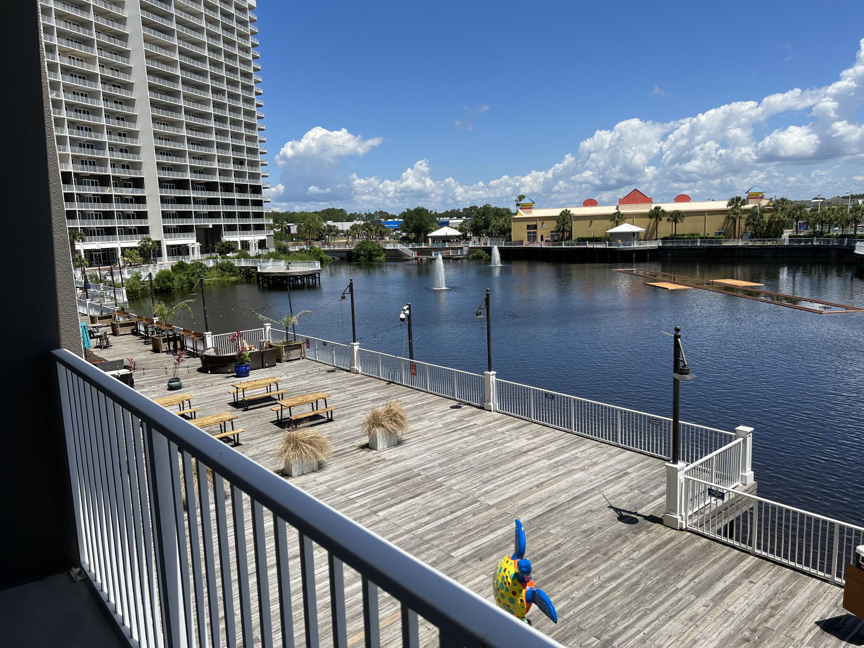 PRICED TO SELL! The perfect blank canvas for the a RE investor! Here's 3 reasons why this is the perfect rental unit! 1. Located on the 1st floor, no wait for those pesky elevators 2. Located in a highly coveted beach resort 3. Restaurant & Entertainment on site. $40k in rental projections! This condo has an absolutely stunning view of the lake and nightly fountain and light show! Laketown Wharf Resort is one of the largest resorts on Panama City Beach. The property is situated along more than 50,000 feet of Lakefront Boardwalk and has a seemingly endless list of amenities to choose from including 5 resort style swimming pools! Enjoy browsing through the many exciting market shops and dining options plus private beach access right across the street. Don't miss out on this opportunity!