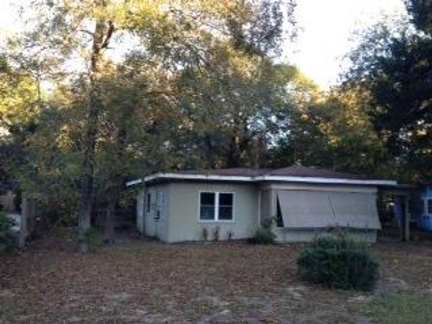 This is an excellent location just steps from the city park and water ramps to the bayou. Lot has partial water view and is very large and cleared. Home bedrooms are generous and the house may need some repairs but this is a great opportunity to build your dream home or use it for rental income. Sale is in ''As-Is'' conditions. House need repairs. No central HACV. Washer and dryer hook ups location is at the carport. Take a look at this one; a lot of possibilities.