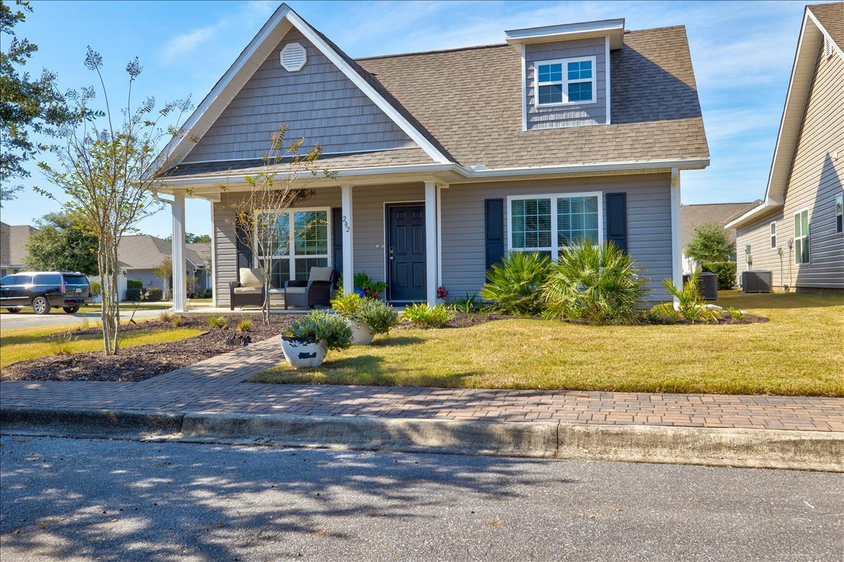 **Home is back on the market with no fault to the seller** Situated in the heart of Hammock Bay, this corner lot home is a beautiful and well maintained 3 bedroom, 2 bathroom home that is available to call yours! 282 Nelly Street boasts crown molding with large bedrooms, an open concept kitchen, a bright living area, with a spacious two-car garage and a back road entrance. You will enjoy a bonus 18'W x 7'H Lifestyle Garage Screen Door, with upgraded 17x20 white PVC coated polyester screen fabric and center passage door that transforms the garage to a cool, airy, bug-free, outdoor space in a snap and and a lovely Ashland 10ft x 14ft cedar pergola with bar and electric at the back entrance. Every yard in Schooner Landing is Maintained: Cut, fertilized, mulched and irrigation are included. You will fall in love with Hammock Bay. A premier master-planned residential community located along Highway 20 renowned for its unparalleled amenities. This 3,200 acres serene community is a unique, sought after and environmentally responsible community that offers a one-of-a-kind lifestyle for residents of all ages, a 25-meter lap pool and two more resort-style pools), 4000 sq. ft. state-of-the-art 24-hr fitness center, lighted basketball, tennis and pickleball courts, dog park (provides an outdoor doggy-washing station and drinking-bubblers), a beautiful private clubhouse for parties and other functions complete with a full kitchen and a private theatre. There are putting greens, picnic and outdoor cooking facilities, a gorgeous gazebo, an outdoor theatre with a courtyard, and a lovely General Store. Many wonderful community events are held here throughout the year including the monthly Farmer's Market! Miles of serene walking and hiking paths, green spaces, stocked ponds and a private bay club with 480' of shoreline on the Choctawhatchee Bay and 500 ft. long dock with boat moorings and fishing pier. Amenities come with keyless access and campus security. A Town Square-lawn-style amphitheater is designed for gatherings and events held throughout the year! We invite you to take a tour of this lovely home and experience first-hand Hammock Bay's way of life! Freeport is a vibrant, growing community on the Choctawhatchee Bay, less than 30 minutes from the famous Emerald Green Gulf Coast beaches, 30A, and all the activities, dining, and shopping that make this such a special place! Easy commutes to beaches of South Walton, Destin, Niceville, major airports, Eglin, and Hurlburt Air Force Bases, discover what makes Hammock Bay so fabulous! There is a 60-acre Sports Park featuring a multitude of ball field/park amenities within walking distance. Come home to Hammock Bay!