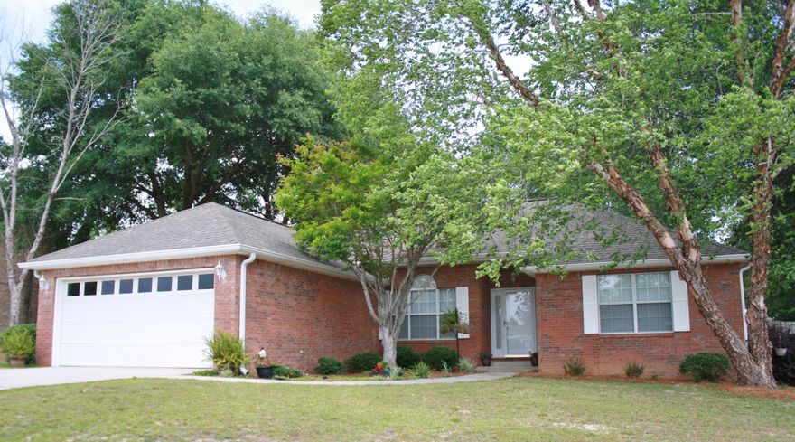 This beautiful 3 bedroom, 2 bath home is a must see! The split bedroom plan offers lots of space and you couldn't ask for a better layout and more storage space. Not only do you have a formal dining room, but you also have a spacious eat in kitchen with stainless steel appliances with an added breakfast bar. The living area has a gas fireplace for those chilly nights, and french doors open to the beautiful back yard with large patio. The large master bedroom is located off the kitchen and has a spacious master bath with double vanity, stand up shower and walk in closet. Double car garage has a pull down attic. This home is convenient to everything and the curb appeal alone will draw you straight in to this beautiful home and over sized back yard with privacy fence.