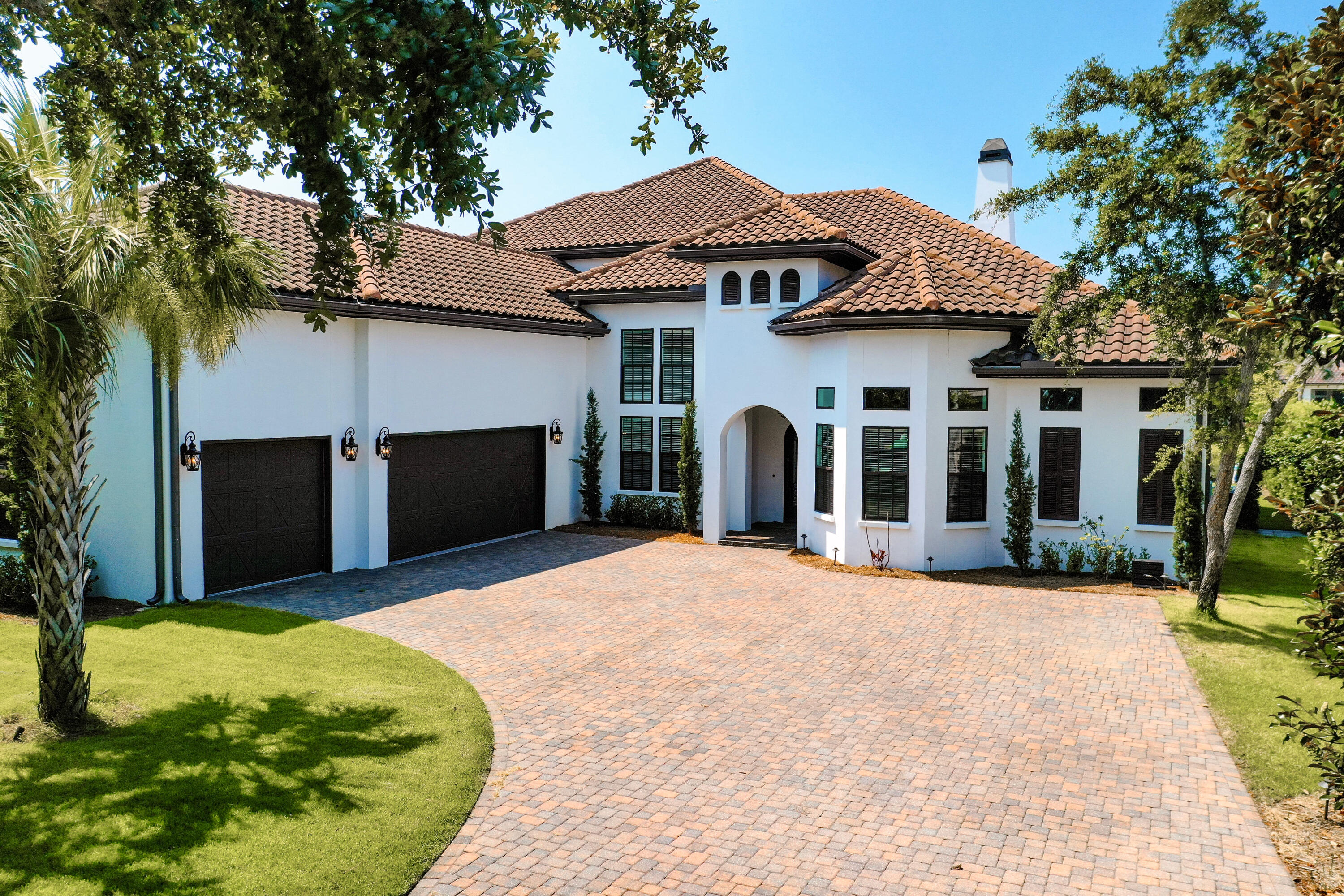 Builder's personal home - upgraded with recent renovations! This extraordinary estate is located in the exclusive lakefront setting of Regatta Bay, a gated country club golf community in Destin, Florida. It is one of the most impressive homes currently available in the community, which prohibits short term rentals and allows for private ownership to enjoy the magnificent estates and amenities, including the golf club, tennis courts, and pools. Legendary Marine and its popular boating club are only a short stroll away from the owners' rear private gate.The floor plan of this grand home includes a total of five bedrooms, three of which are on the first floor.