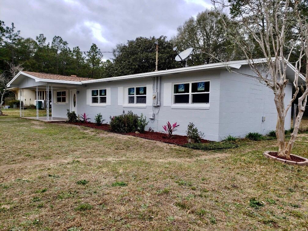 Effective year 2010. Nicely renovated with attention to detail from the ground up including new floors, paint, light fixtures/fans, doors, windows and features a split floor plan! Low maintenance floors throughout. Enjoy brand-new craftsman style windows in the entire home as well. All new stainless-steel appliances to be installed by Feb 16th, and granite being installed Friday the 5th. As you walk in, you will be greeted by the vaulted ceiling living room and the beautiful fireplace as a centerpiece of the space. Kitchen includes new cabinetry and granite countertops with an open floor plan to the dining area. The main bedroom is located off of the living room with your own private entrance/exit into the back yard. The main bathroom includes a sizable closet,