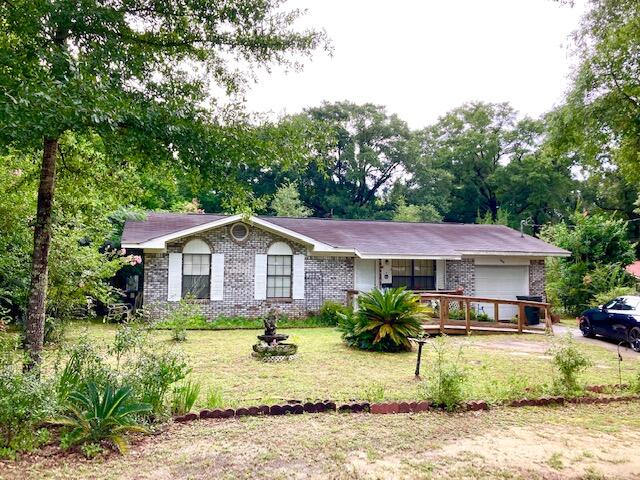 WELL PRICED RANCH HOME IN TOWN -- Cozy brick 2BR 1BA home situated on a level lot. Kitchen features a smooth top electric range, stainless refrigerator with water & ice in door, double stainless sink, and a pantry. Washer & dryer are included in the sale. This property also features a one car garage and a 13' by 9' sunroom. The hall bath has been updated with a walk-in shower with handicap shower and grab bars. There is central Heat & Air in the main house, and a window unit in the sunroom. Quiet neighborhood close in on the West side of town, so you will be near all of the downtown amenities and activities. This one won't last long.