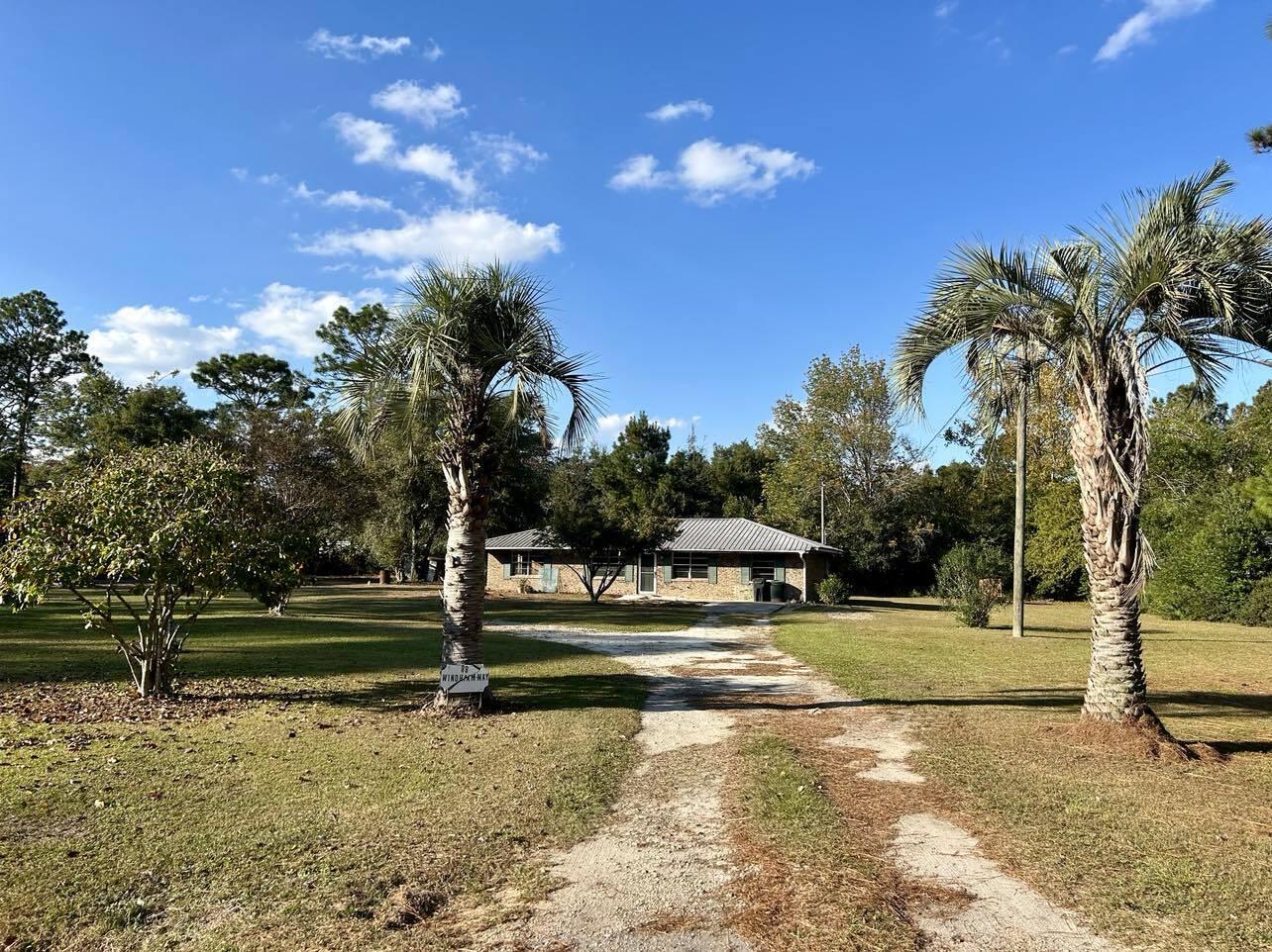 Charming brick home on one acre in the Juniper Lake area. Residence combines classic charm with modern potential. With a little TLC this would be the perfect retreat for families or anyone seeking a peaceful lifestyle. Over 1325 sq ft, three bedrooms plus two bonus rooms that could be used for office space, playroom, hobbies, etc. When you step outside you'll be greeted by the expansive outdoor space, perfect for entertaining, gardening, etc. The lush surroundings offer privacy. Easy access to Juniper Lake Park, Juniper Lake Park offers picnic tables, boat launches and has restrooms. Home is is located on a paved county maintained road.