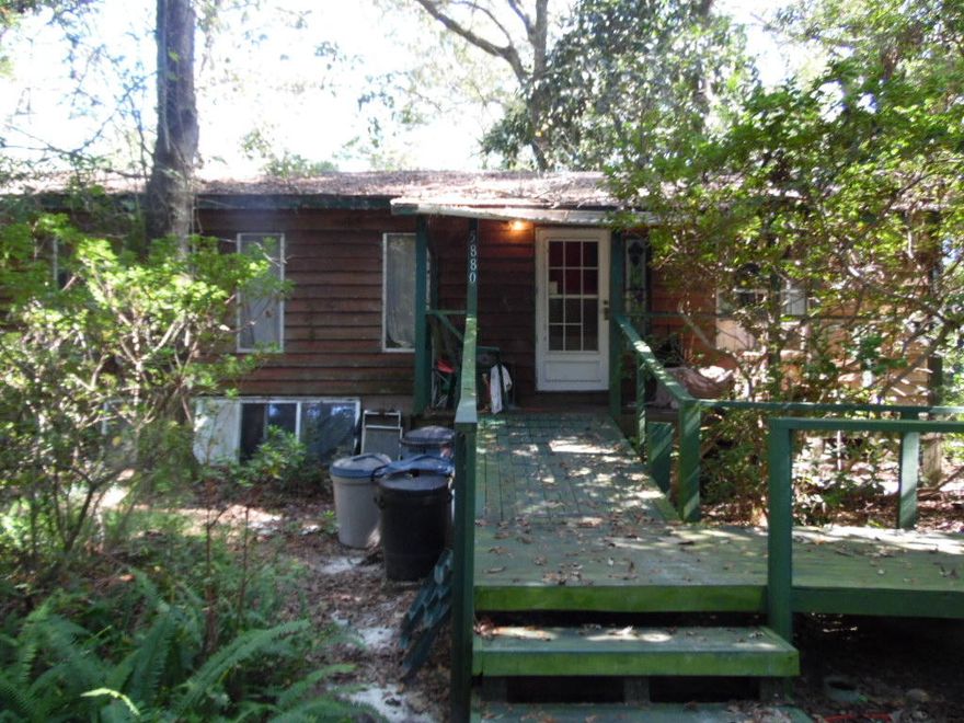 One bedroom, one bathroom cottage in the woods. Over two and a half acres with several outbuildings! Most of the value is in the land and location!Home is being sold ''AS IS''. Price reflects this!