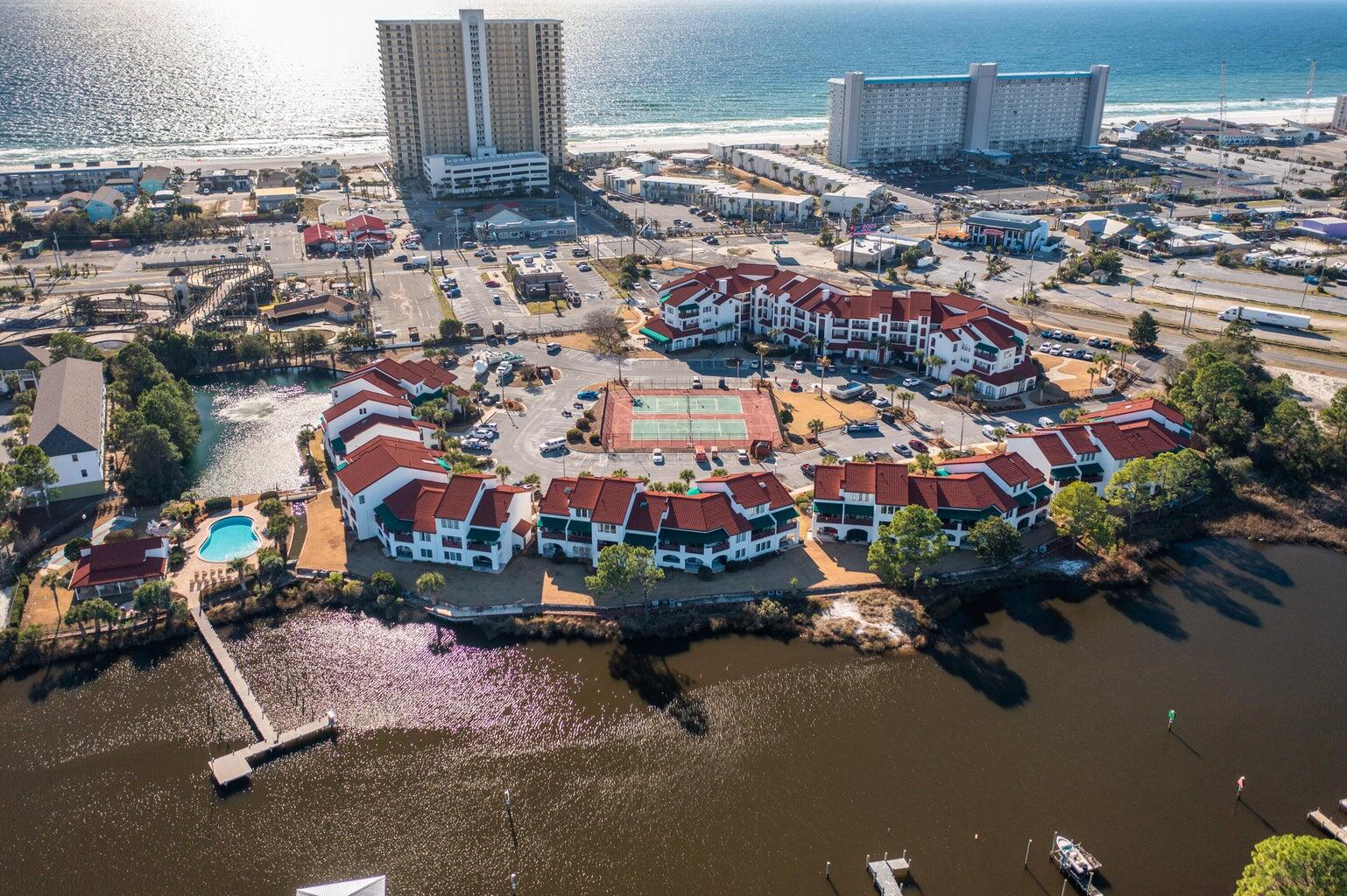 Check out this beautiful studio condo in central Panama City Beach. This unit is on the 2nd floor at and accessible by elevator or stairs. This studio boasts easy walking distance to the public beach access. The Inn at St. Thomas Square is a gated, European-inspired villa resort directly across from the beach. Located on the Grand Lagoon with access to the Gulf of Mexico this property features a boating dock. The dock space is first come first serve and owner trailer parking is allowed onsite. Complex amenities include a Mexican grill, salon, gym, and tennis courts! Plus, guests will have access to a shared pool, tennis & pickle ball courts, BBQ area with seating, sauna, shuffle board, firepit area and a boat dock.