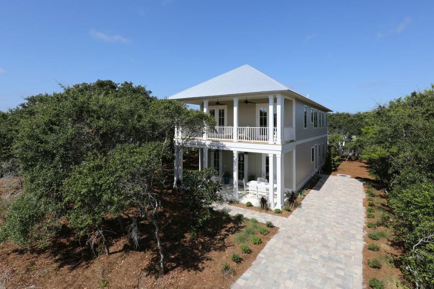 Stunning new custom construction tucked away on a quiet street in the heart of Historic Blue Mountain Beach. This home is south of Scenic Hwy 30A and just 3 lots from the beach access. Nearby to several neighborhoods beach accesses, a 25-mile bike path as well as unique shopping and dining. Casual luxury describes this finely built home full of glorious upgrades throughout. There is 3,920 SF of living space with 2,880 SF heated & cooled. Open floor plan, huge windows and glass doors invite the beautiful outdoors and sunshine in, raised ceilings, top quality engineered wide panel oak floors, top of the line stainless steel appliances, recessed lighting are only a few of the unique quality features this home offers. The kitchen features beautiful custom cabinets, a 6 burner stove, a large