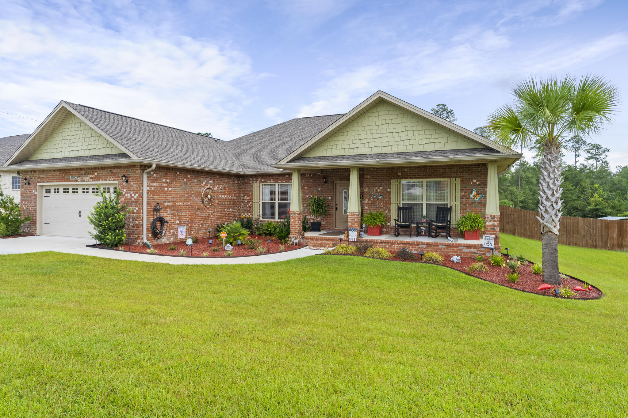 STUNNINGLY, BEAUTIFUL HOME IN CRESTVIEW! Step inside to see the entryway open onto the main living areas. The living area is framed perfectly by tray ceilings and three large windows that bring in an abundance of natural light. The kitchen features granite countertops, stainless steel appliances, breakfast bar and pantry. The master bedroom offers a plethora of space and a private ensuite. The primary bathroom features a separate shower, garden tub, and double vanity. The home also features a bonus room, dedicated laundry room, attached garage, oversized driveway, and three additional bedrooms that offer plenty of space for the entire family. Spend your days inside enjoying your beautiful home or outside in the stunning, unique patio and deck. The deck features electrical outlets, a fan,