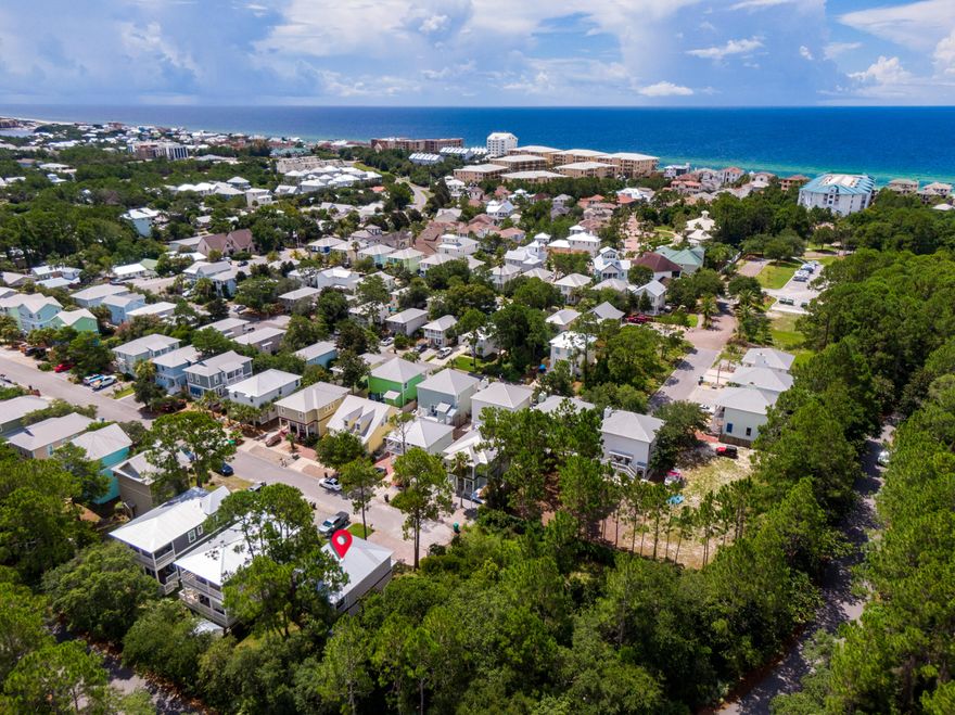 Cozy beach house with expansive backyard conveniently located South of 30A in the highly desirable Blue Mountain Beach neighborhood! Just minutes away from multiple public beach access points, this home is situated at the end of a dead end road with densely wooded areas to the North and West of the lot for added privacy. Stepping in you will first notice this home is expertly designed, decorated and fully furnished, with exclusive Justin Gaffrey artwork alone worth $47k. The open floor plan, living, dining and kitchen areas flow seamless together with an inviting atmosphere. An abundance of natural light brings an airy feel to the entire home. The fenced-in backyard has a Zen ambiance with plenty of green foliage and trees, room for entertaining, outdoor dining and a covered back porch.  A great spot to relax and enjoy the outdoors. There is also an outdoor shower for those sandy trips back from the beach! The kitchen comes equipped with stainless steel Frigidaire appliances, gas stove and range, cabinets to the ceilings, ample counter space and room for multiple bar stools. On the first floor you will also find a guest bedroom and a full bathroom. Washer and dryer are located on the first floor as well. Upstairs are the additional two guest bedrooms, and full bathroom and the master suite. The master bedroom has its own large private balcony overlooking the backyard.