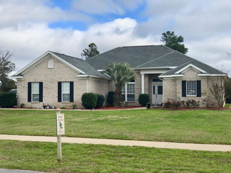 Come see this beautiful 4 bedroom, 3 full bath home in Windswept Estates. Wood flooring greets you as you enter thru the front door & continues in the living & dining room. Large tiled flooring in the kitchen, bathroom and family room. The split floor plan has the master suite on one side of the home and 3 bedrooms with 2 full baths on the other. Stainless steel appliances have an extended warranty for the next 3 1/2 years, solid surface countertops and plenty of cabinets. Family gatherings easily can be seated at the large kitchen bar counter with breakfast area and family room with a fireplace. The master suite features a treyed ceiling, carpet and french doors that leads out to a screened-in porch. The master bath has a separate cultured marble surround shower, 2 vanities,