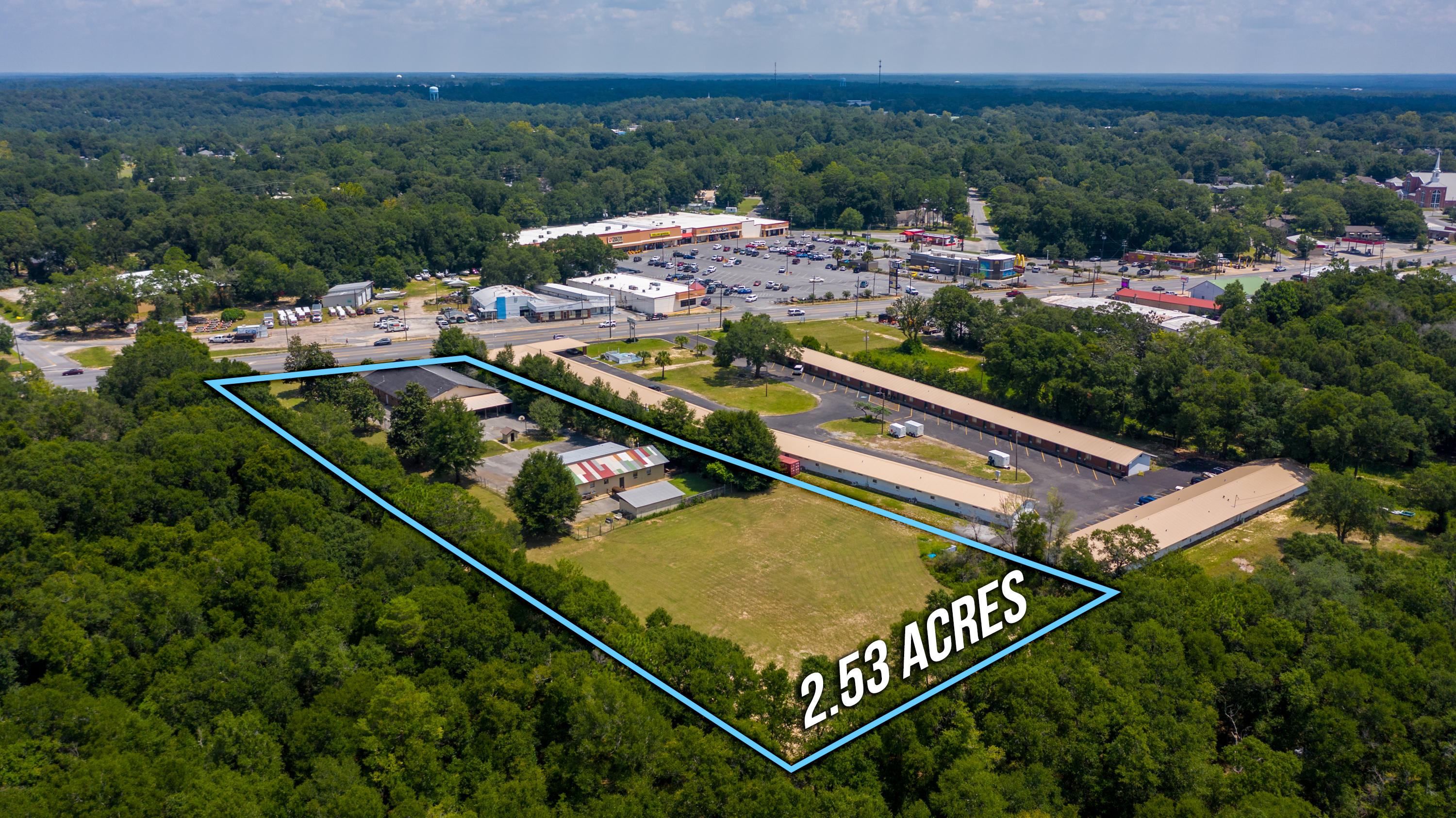 Commercial property located in the heart of Crestview. This property has tremendous potential with many different potential uses. Property is located in HWY 90 (W. James Lee Blvd) in Crestview just across from the Tractor Supply and Dollar General anchored shopping center. With approx. 21,000 AADT and 178 ft of frontage property is easily accessed and has great visibility. Property features a 5,400 sf office building and a 1,800 sf second building that is currently configured as a residence with 3beds and 1.5 bath. The front office building is 60x90 and is configured with offices and bathrooms. This building can easily be divided into 2 30x90 ''boxes''. Property is currently occupied by church on month to month basis. Tenant will vacate prior to closing.
