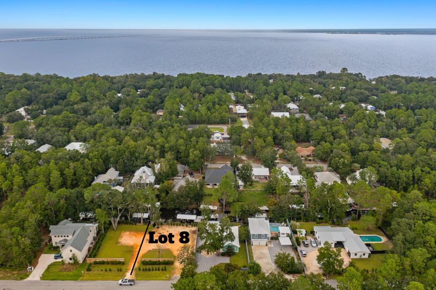 Discover an exceptional opportunity to build with no HOA, on a quarter-acre WATERFRONT lot in Historic Point Washington. This cleared and build-ready homesite offers approximately 75 feet of serene canal-front shoreline with direct access to the Choctawhatchee Bay.With a private dock and designated boat slip  and lift already in place, this property is ideal for boating, fishing, paddle boarding, or simply enjoying life on the water. The lot sits highd offering excellent elevation and a perfect canvas to design your custom retreat.Located a short distance from the state park trails and minutes from world-class beaches, shopping, and dining along 30A, this setting offers the perfect blend of quiet natural surroundings, everyday convenience, and coastal luxury