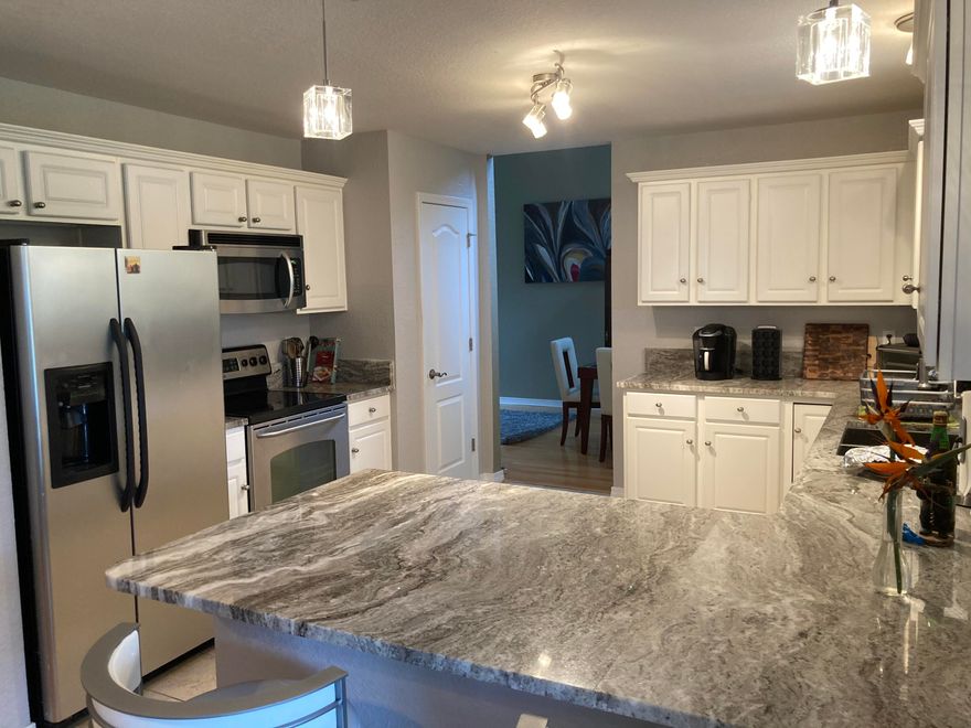 Professional photos coming soon. Picturesque views will greet you daily. Only 1 block from the bay and approximately 15 minutes to the beaches! Property backs up to a lake that adds additional beauty and wildlife! On the first level, you will find the kitchen had updated fixtures and granite countertops done in 2019. HVAC replaced 2017. Living room with fireplace that has granite encasing it that matches counters. Additional living space has ceilings that span the height of the home to add to the spacious feel. As you make your way upstairs, you will find ample room and storage in the 4 bedrooms, master having double door entry. Back yard boasts plenty of room for entertaining or kids' play and backs to lake for fishing if desired.