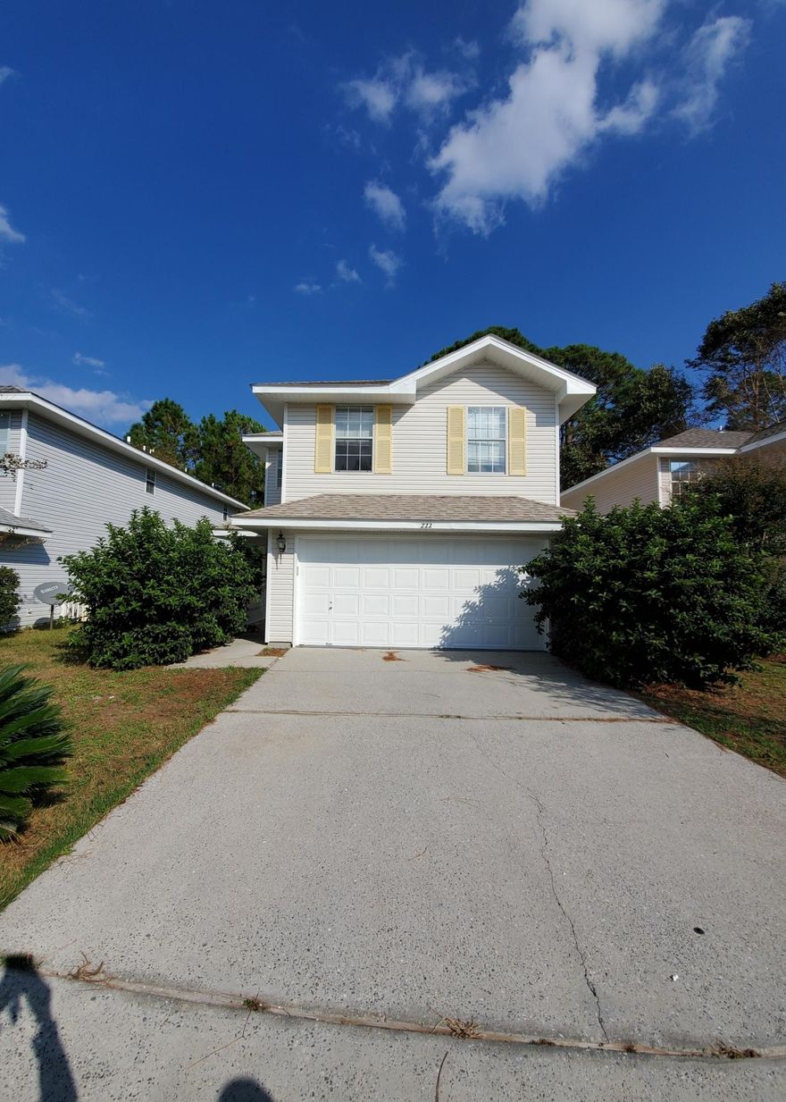Welcome home! Large two story contemporary style 3 bedroom 2.5 bath home for sale in the desirable Twin Lakes subdivision of Destin. Just minutes from shopping, dining, and beaches. Large open living dining combo with beautiful fireplace and tall ceilings. Half bath located downstairs. Three bedrooms, 2 full baths, plus a large secondary living space just off the landing, perfect for a playroom for the kids or an office area. Large master suite. This property has been freshly painted and is ready to show! Schedule a viewing today.