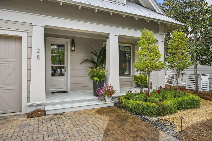 Situated in Phase II of Cypress Dunes, this bright and spacious home features high end finishes,  beautifully updated kitchen complete with stainless steel appliances and custom cabinetry, as well as a first-floor primary suite. French doors open to a screened rear porch overlooking mature trees and a serene backyard complemented by a fountain and stone pavers. All hardwood floors on first level  Three additional bedrooms are located on the second floor. Home is being sold with furniture only, no artwork or glassware to remain. Exceptions will be detailed upon request.