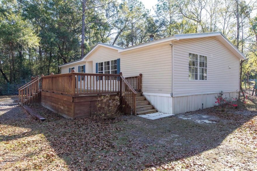 Welcome to your fully remodeled, charming, manufactured home nestled in the heart of Freeport! This 3-bedroom, 2-bathroom residence spans 1,338 square feet and has been meticulously renovated to offer modern comfort and style. Step inside to discover a spacious living area perfect for relaxing or entertaining guests. The updated kitchen boasts sleek countertops, stainless steel appliances, and ample cabinet space, making meal preparation a breeze.Enjoy the convenience of having electricity, water, and a septic system already in place, along with irrigation for the surrounding land. With a new Publix and shopping areas nearby, daily errands are a breeze. Located just minutes away from the breathtaking bay and beach, as well as the intersection of Hwy 331 & Hwy 20, this property.