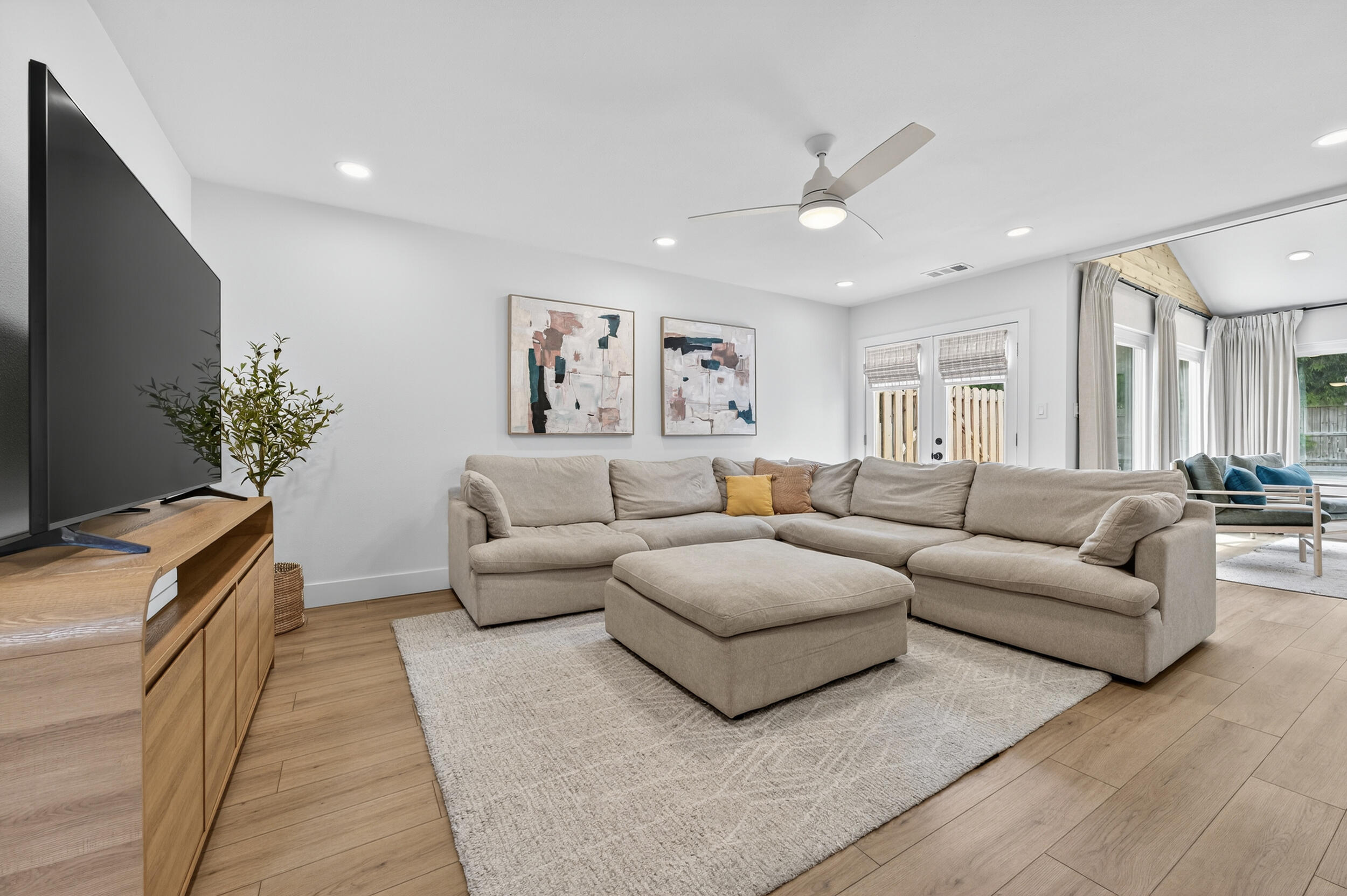 Step inside this updated end-unit townhome in Perdido Bay Villas, where thoughtful upgrades and a bright, inviting layout make it move-in ready! Featuring a 2022 roof, 2025 water heater, and all impact glass windows, the home has been thoughtfully upgraded and permitted by the county. (See notable features in MLS docs). This property is also a great opportunity for a short term rental with projections coming in at $23K+! With two spacious bedrooms, each with a private en suite bathroom, a sunroom, and inviting living spaces, this residence is ideal as a primary home, vacation retreat, or short-term rental investment. Inside features warm wood-look flooring, a neutral paint palette, and recessed lighting throughout! The kitchen has been beautifully renovated with soft-close white cabinetr y, quartz countertops, a modern backsplash, black hardware and accents, and stainless steel appliances. A breakfast bar and adjacent dining area provide plenty of space for entertaining. From here, step out to a private courtyard perfect for grilling or enjoying outdoor meals! The spacious living room, anchored by a striking wooden staircase, flows seamlessly into the sunroom, which features a vaulted ceiling and rich wood and brick accent walls that add warmth and charm. French doors lead outside to a concrete patio and a communal green space, extending your living area outdoors. A remodeled half bath with a new vanity and quartz counters conveniently between the kitchen and living room. Upstairs, the primary suite offers a private balcony overlooking the outdoor area. Both baths are equipped with tiled tub/shower combos, large vanities, and quartz countertops. With modern updates, thoughtful design, and a prime location, this move-in ready townhome is the perfect full-time residence, vacation getaway, or investment property!