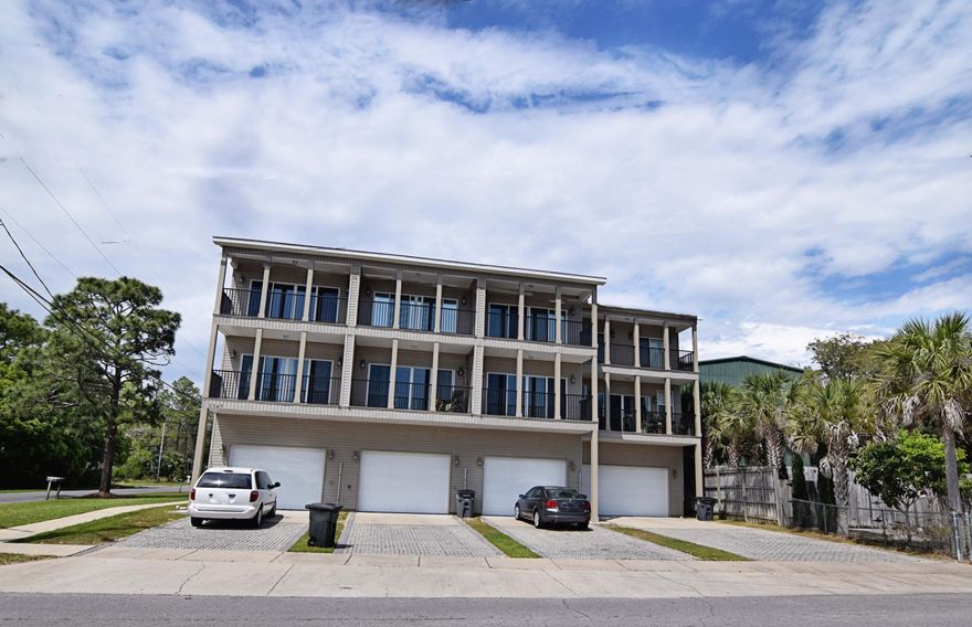 WATERVIEW QUADPLEX (4) 3-story townhomes on Bayshore Dr directly across from Tom's Bayou. Waterview balconies on the top two floors of each unit. Each with a single car garage on the ground level; kitchen-living area, balcony and half bath on the second; and third level consisting of laundry closet, 2 bedrooms (one with balcony) and a full bath. (3) units 1239 sq/ft, (1) unit 1040 sq/ft. 3 of 4 units currently occupied, 1 unit available for showings. Boat,kayak,paddle board and fishing dock near by. GREAT investment! Schedule your showing today! Current rent is discounted due to Military tenants.