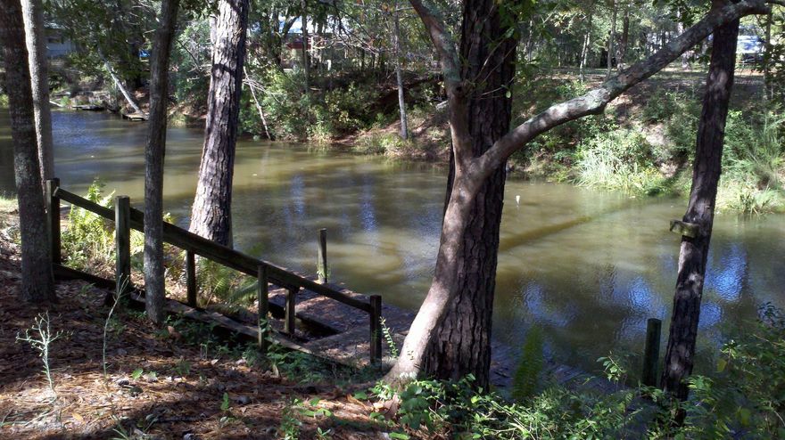 The land includes a 3 bedroom,2 bath mobile home which conveys as-is. The value is in the land which is waterfront on a canal that leads to the bay. There is a dock in place. The land has the potential of being zoned commercial.