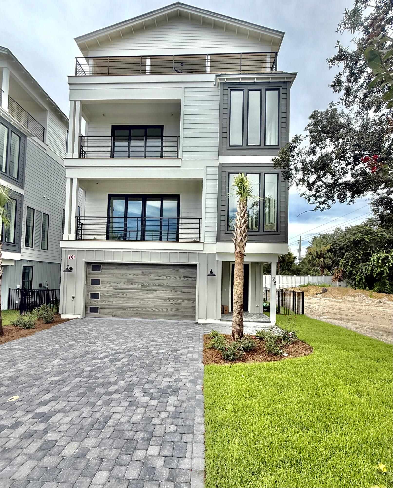 Brand new, just completed...Gorgeous four-story rental dream, south of 30A on Mary Street in Blue Mountain Beach. Perfect for indoor and outdoor entertaining with less than a 5 minute walk to the beach, the house features rental income projections of around $235,000. Designed with vacation in mind, the first level includes a half bath and mini kitchen with a full sliding wall that opens to the pool deck. The second floor features the spacious kitchen, dining and living area, perfect for large families or parties to gather. The kitchen features Thermador appliances, a gas stove, ample counter space for serving, and a walk-in pantry. The third floor boasts a lovely master suite with a private balcony.