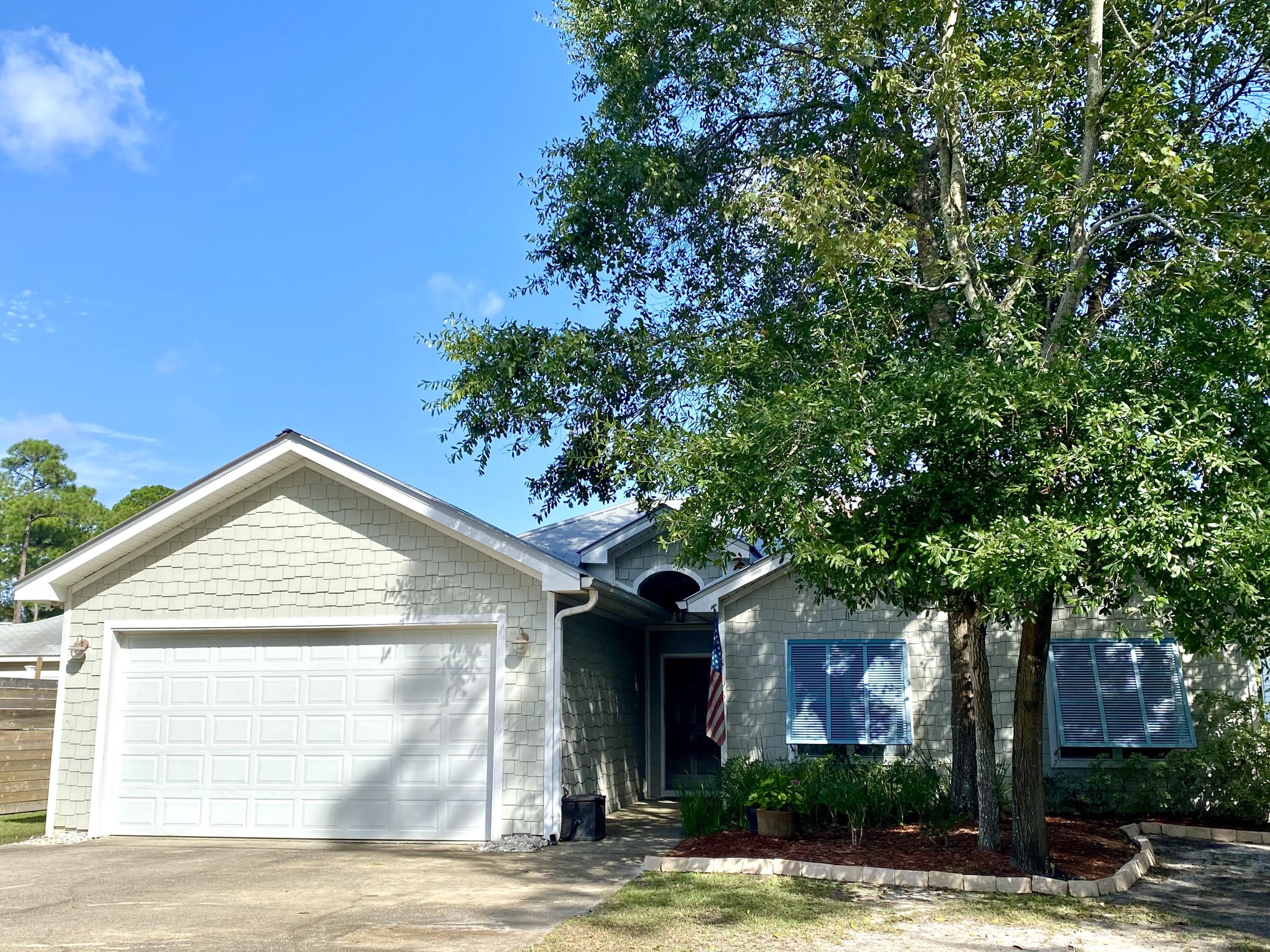 This charming home, located in Palmetto Plantation (a family friendly community with a community pool), features vaulted ceilings in the living, kitchen and dining areas with an abundance of natural light throughout. The Master bedroom is spacious and features a private water view as well. It also includes two large closets, one a walk-in closet, and en-suite bathroom with garden tub and separate shower. The other two bedrooms feature large windows as well and share a full bath. In addition there is an enclosed sunroom (approx. an additional 168 sq ft) currently used as an office/playroom that gives you access to the private fenced-in backyard. Finally there is a full 2-car attached garage and plenty of drive way parking as well. Being sold fully furnished except the 2 kids bedrooms.