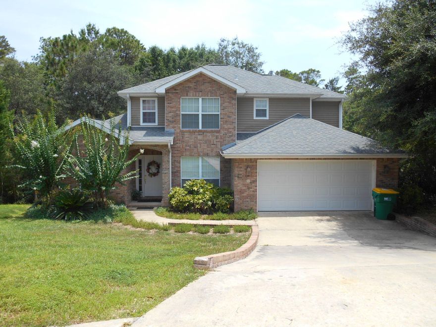 Another quality 4 Bedroom 2.5 Bath home built by Barton Homes. The home is situated on a beautiful private lot that backs up to a wooded area owned by the City of Niceville.Kitchen features granite counter tops with a large island, lots of beautiful oak cabinets for plenty of storage and Kenmore appliances; perfect for the aspiring chef in you. Kitchen is open to a beautiful two story Great Room with lots of windows for plenty of natural light and a gas fireplace to take the chill out of the air on those rare cool evenings around here.Master Suite is located on the first floor while other three bedrooms are upstairs. Cultured Marble counter tops with dual vanities in baths, Master has jetted tub with beautiful tile surround, separate walk-in shower and a monstrous walk-in clos