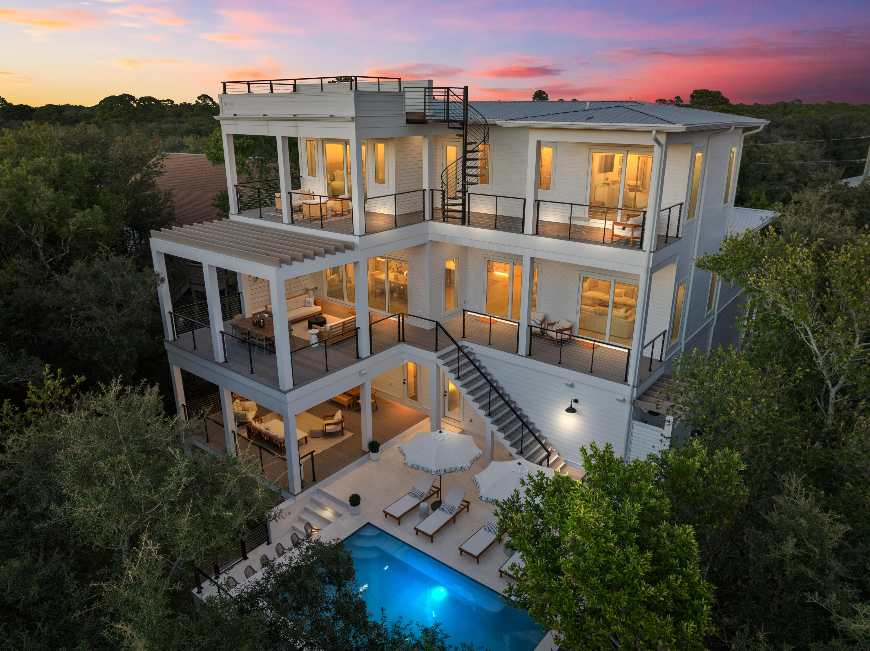 Exquisite Gulf-View Estate | 185 Dune LaneWelcome to one of the most luxurious homes in the heart of West 30A, perched at an impressive ~40 ft elevation with breathtaking panoramic views of the Gulf. This fully furnished and meticulously designed residence redefines coastal elegance, offering 6 bedrooms, 6 bathrooms, and 2 half baths across three spacious levels.A short stroll to three regional beach access points and the pristine, untouched shores of Topsail State Park, featuring over 3 miles of beach and stunning coastal dune lakes.Entertain with ease on expansive outdoor balconies, a stunning pool with in-water barstools, high-top chairs for poolside conversations, and a full-service first-floor kitchen and an outdoor summer kitchen to enjoy fresco dining under the stars! The elegant first floor features two spacious bedrooms with ensuite baths, a laundry room, a commercial ice machine, and a well-appointed kitchen serving the pool area.
The opulent second floor is designed for royalty, this level boasts a gourmet kitchen with upscale appliances, a butler's pantry, a custom bar, a whitewashed stone accent wall, a spacious dining area, a light-filled living space, a movie theater, and a master suite that exudes sophistication.
The luxurious 3rd floor offers a custom-designed bunk room with four double beds and an ensuite bath, as well as two master suites with access to a spacious balcony providing sweeping Gulf views and access to a rooftop terrace, where you can enjoy stunning sunrises and sunsets over the treetops.
Positioned on a large lot with ample outdoor space for entertaining or relaxing. Four-car garage, covered terrace, and an expansive paver driveway for plenty of parking. High-end finishes and thoughtful details throughout, combining comfort and luxury.
Close to so many great amenities and restaurants including Stinky's Fish Camp, Shunk Gully, Santa Rosa Beach and Golf Club, Gulf Place, and more.
This estate is truly one of the finest homes on Scenic 30A, offering the pinnacle of coastal living. Whether you're hosting lavish gatherings or simply enjoying quiet moments by the Gulf, 185 Dune Lane is a property that captivates and inspires.
Experience the Luxe Life - Schedule Your Private Tour Today.