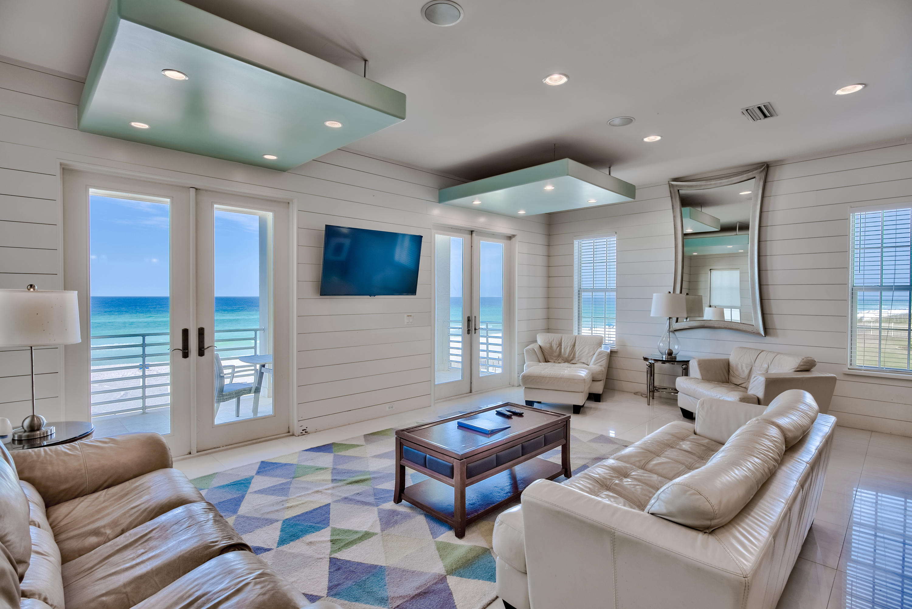 Prime gulf front positioning paired with sweeping western views characterize this beachfront retreat which boasts 7 bedrooms and strong short term rental potential ($240,000 - $295,000 in gross projected annual rental income) primely located in the gated neighborhood of Shipwatch. Masterfully built in 2012, this home was thoughtfully designed with ample parking and amenities including a private beachfront pool, oversized two car garage and private elevator. Upon entry, the first level boasts two gulf front bedroom suites that provide direct access to the covered south facing patio and gulf front pool area.