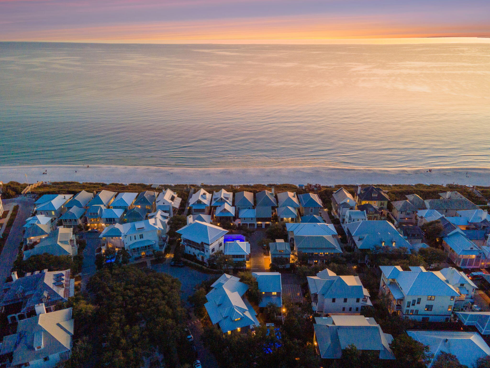 A Mediterranean-inspired, Gulf coast oasis, this stunning  estate offers the perfect blend of luxury, location and comfort. Located at the sought-after, peaceful end of East Rosemary Beach, the front door faces  a lush, private park.  Only 100 steps to the beach down walkover A, the sounds of surf can be heard from the master suite balcony.The Venetian designed 12 ft mahogany front door invites you into the main floor in a place of very special memories. The home boasts 14-foot ceilings of hand hewn 100-year-old pecky cypress. Restoration Hardware raindrop ceiling fixtures and crafted white stucco walls speak of an Italian seaside home. Dark, sturdy wood floors offset the whitewashed walls. The custom furnishings call to you in the blue, sand, green and white colors of the sea and sky. The newly remodeled kitchen features a 12-foot Cambria  Quartzstone Island perfect for family breakfasts, wine and appetizers or  laptops plugged into the USB ports. The appliances include Sub Zero: double door refrigerator, Ice maker, wine cooler, Wolf Chef's 6 burner range, 

A solid grey dining table seats  8- 10 plus 4 at the bar  and feature white leather seating by Rove Concepts. Furnishings in living and dining room are by Tracery,  Beau Interiors  and Bohlert Massey. 
The main floor also features a king bed guest area with ?? bath and laundry area.

A stunning, handmade, curved staircase takes you a welcoming master suite with porch and two separate his and hers baths, jacuzzi and steam shower,  and walk in closet.  The second guest area and three-quarter bath face the park overlooking from a second porch. Continuing up the 3rd floor  into the two-bedroom kids delight. Both bedrooms have small gulf views, The larger bedroom has a king bed and two twin beds. These are separated by a TV and play area, and a work desk. The full bath features a jacuzzi tub. 

This unique villa style home  has a covered back porch  designed to dine outside or enjoy the rain in the protection of 12 ft tall mahogany shuttered doors. Step down into the lush back yard where an elegant palm tree graces the oversized pool. A pergola waits at the end of the pool with a firepit centered lounging area. An al dente dining area seats 8, completing a most European feel for outdoor living.

Sitting at the south end of this private sanctuary is the 500 square foot open living plan carriage house. This  bright, cozy apartment was fully remodeled a year ago, with  all new mini kitchen, full bath and inviting king sized bed. The sofa also has a new thermopedic mattress to guarantee a night's rest!

 Certainly, this home is a rare find in all of Rosemary Beach. There is none other like it!
