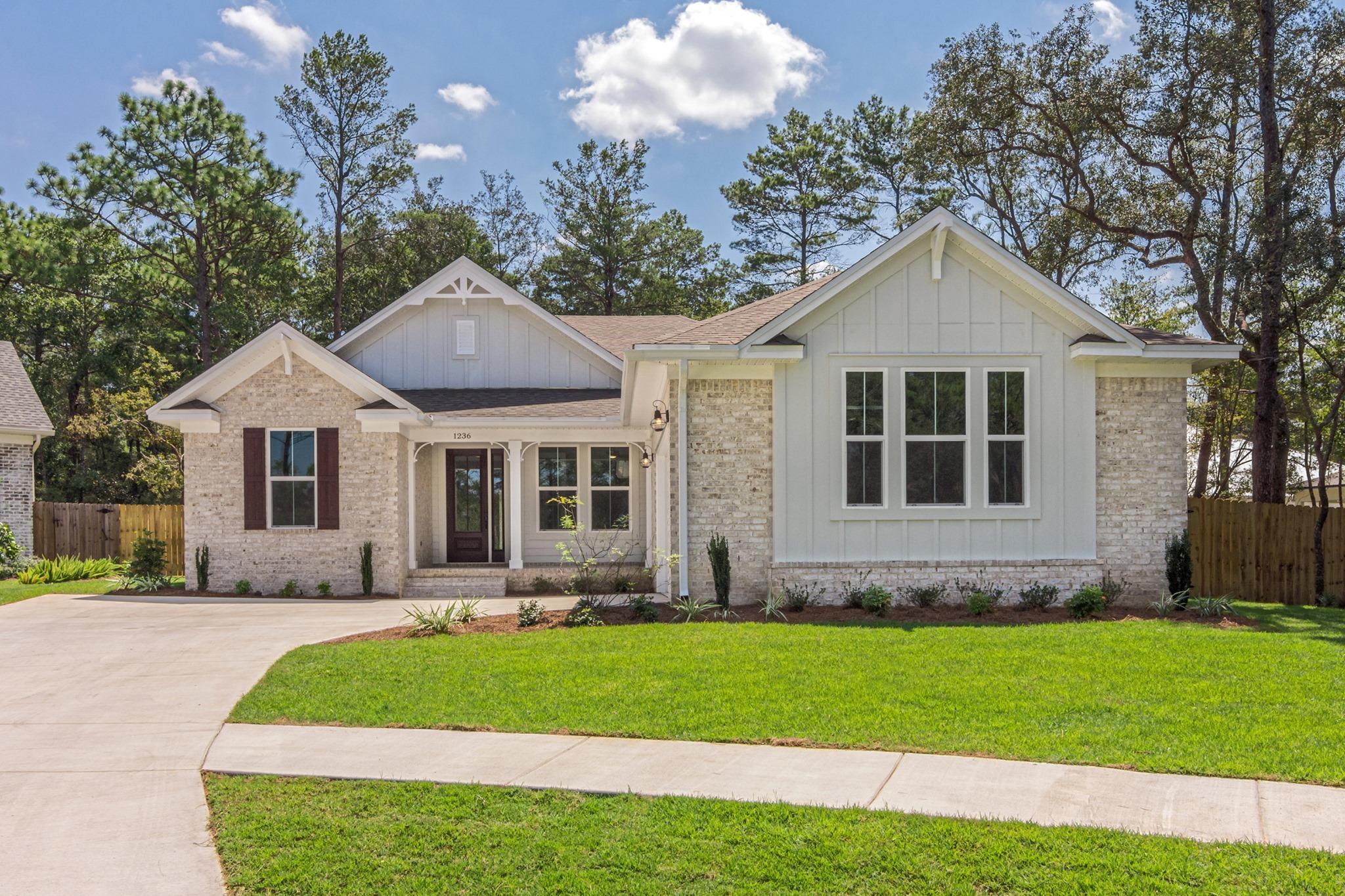 Stunning new 4 bedrooms, 3 full bathrooms home in Niceville's newest community Deer Moss Creek. This beautiful home boast an open floor plan concept, split floor plan, separate formal dining/office area, front porch, lanai, 8' doors, 8' sliding glass door, crown molding in main living areas, tile and engineered hardwood floors, impact resistant windows, prewired for pool equipment, gas tankless water heater, rain head in master shower, ship lap accents, 16 seer hvac, custom mudroom bench seating, barn door, custom upgraded cabinets, tiles, fixture and many more. Home will be finished by the end of August.