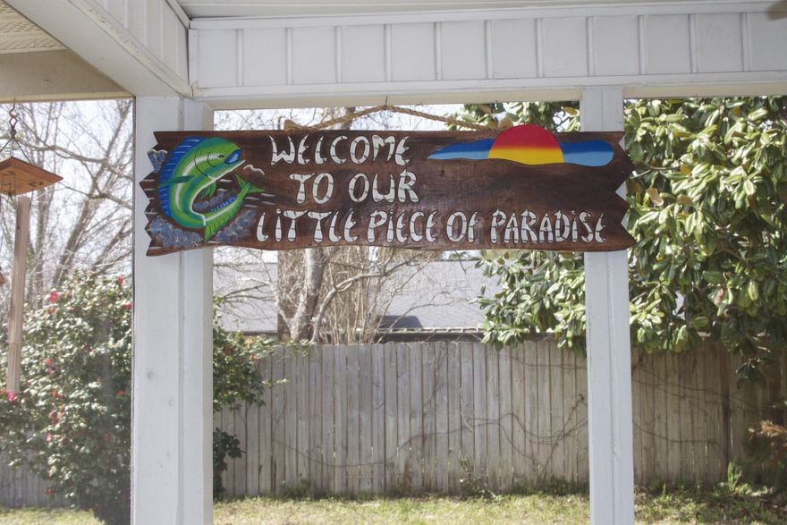 Lovely renovation on the California Cottage style home in the heart of Destin. Open floor plan with high beamed white wood ceilings in main living area, stone faced wood burning fire place and large picture windows with ceiling skylight. All new wood floors in living, halls and bedrooms, new large tiled floors in kitchen with updated lighting and stainless appliances. The oversized master bedroom has two closets and updated master bath with new vanity and granite counter top. Recessed lighting sprinkler system and newer metal roof. Owners have wired the home with ADT security system wiring and have added a punch coded front door. In addition owners have added an extra cement parking pad for boat or extra parking. Large yard close to harbor and schools and VA eligible property.