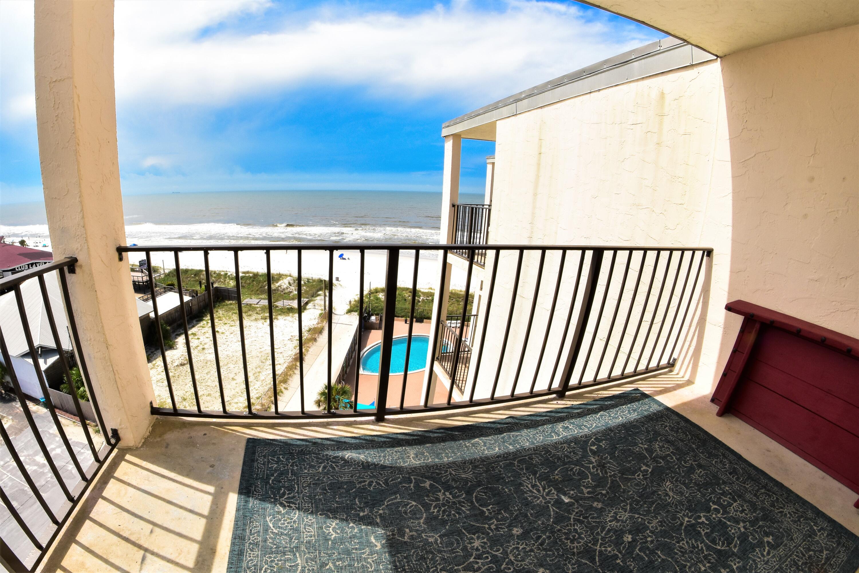 Unbelievable views from this TOP floor Moondrifter condo!! This is an end unit with both north and south facing views!! Beautifully appointed, this 2-bedroom, 2-bath unit has been recently remodeled and is being sold furnished and rental ready! Enjoy panoramic views of the Gulf of Mexico from your private balcony! Features include tile flooring with the exception of the bedrooms, a stacked washer & dryer, storage closet for your guests and a lockout owners closet, and a barn door entrance to the Master bedroom. Moondrifter amenities include a pool, tennis courts, on-site security, elevators, and a dedicated beach. You're also walking distance to many restaurants and family-friendly attractions. Great second home or income producing rental! All info approx. Buyers must verify.
