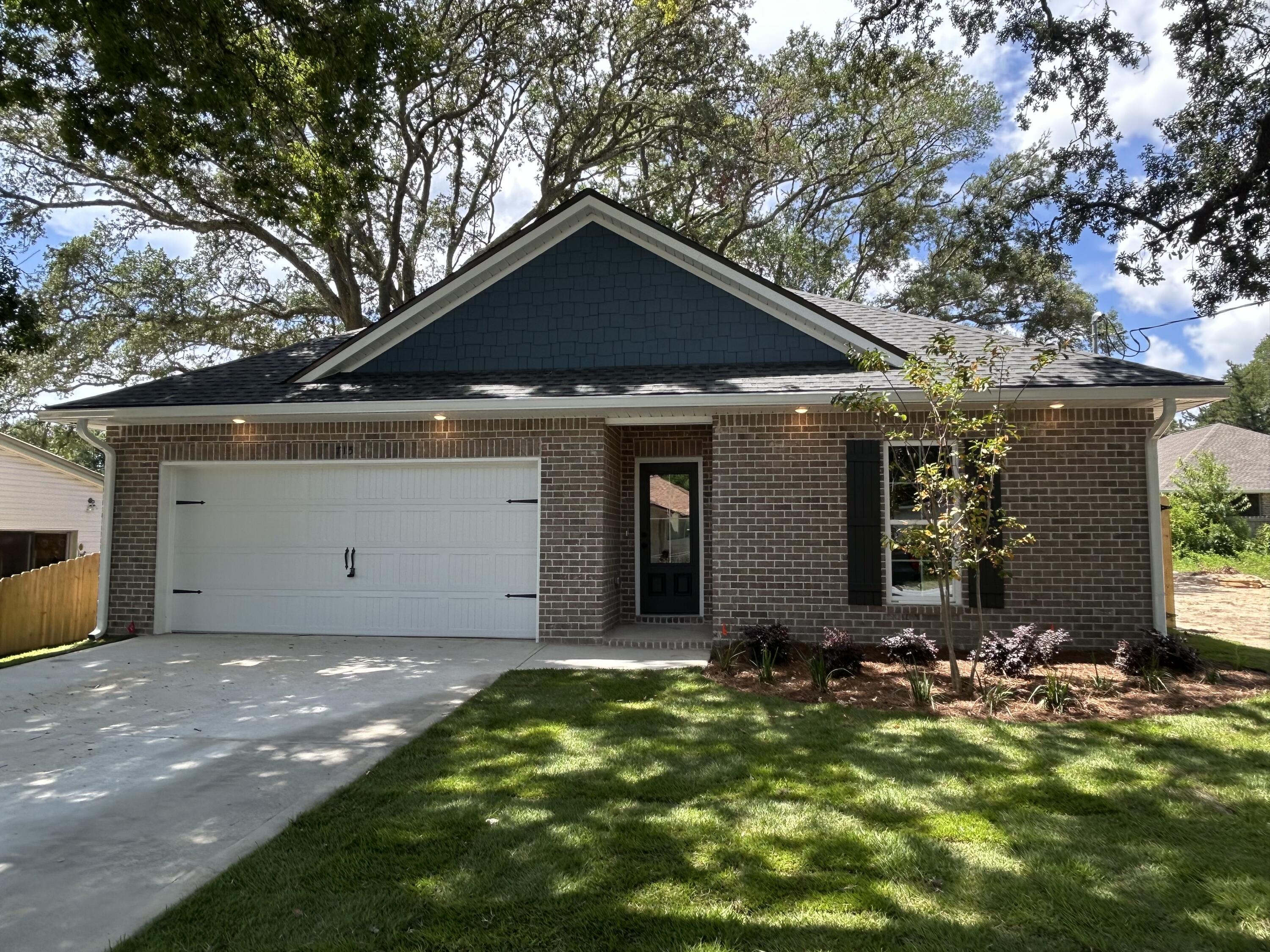 New Construction with an estimated completion date of July 31. This beautiful 3-bedroom, 2-bathroom home by local builder offers quality craftsmanship and modern design in a classic craftsman style. Interior features include quartz countertops, custom shaker-style all-wood cabinets with soft-close doors and drawers, stainless steel appliances, a large center island with breakfast bar, a walk-in pantry, and solid surface flooring throughout for low-allergen living. Additional highlights include 9'-11' ceilings, crown molding, sprinkler system and more! Photos are of a similar floor plan previously built by the same builder; finishes and details may vary.