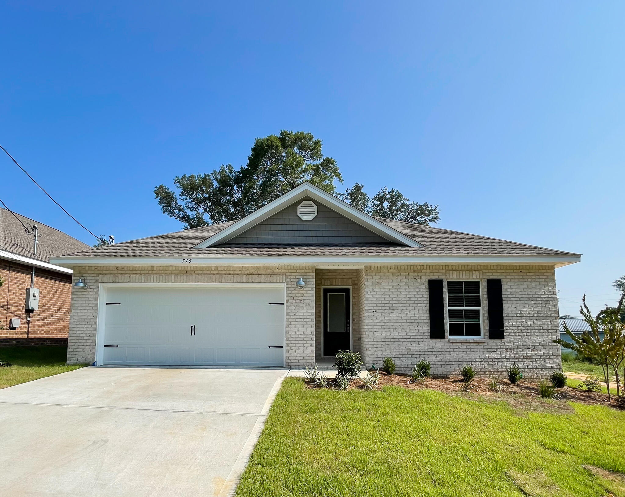 New Construction with an estimated completion date of July 31. This beautiful 3-bedroom, 2-bathroom home by local builder offers quality craftsmanship and modern design in a classic craftsman style. Interior features include quartz countertops, custom shaker-style all-wood cabinets with soft-close doors and drawers, stainless steel appliances, a large center island with breakfast bar, a walk-in pantry, and solid surface flooring throughout for low-allergen living. Additional highlights include 9'-11' ceilings, crown molding, sprinkler system and more! Photos are of a similar floor plan previously built by the same builder; finishes and details may vary. For a limited time, builder is offering an exclusive 4th of July incentive package. The builder will contribute 2% toward the buyer's closing costs and cover doc stamps, title fees, and the final survey. A fenced yard and refrigerator are also included, and buyers may select from multiple blind options to personalize their new home. Additionally, buyers who go under contract by July 4 and close by July 31 will receive a 4th of July Party Pack at closing, which includes a Yeti Haul Cooler, Blackstone Grill, red, white, and blue cornhole boards, and a $100 Walmart gift card. In lieu of the party pack, buyers may opt for an additional $1,000 toward closing costs or a rate buy-down. Contact us for full details.