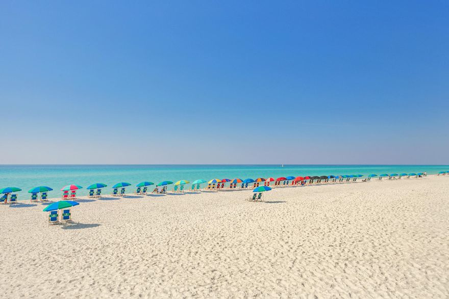 Have you been searching for your special beach condo? Do yourself a favor and come see Sandpiper Cove - a 43 acre resort w/1,100 feet of private beachfront living! This first floor studio Condo is located in a PRIME location just across the street from the beach ...at a pedestrian-controlled traffic signal. The unique studio floor plan has a full kitchen, w/living, dining & bedroom space; front porch area & back porch for relaxing and soaking in the sunshine and gulf breezes. Updated LVP flooring, new furnishings, kitchen, appliances & bathroom! Sleeps 4 with a comfortable sleeper sofa in the living area. BEACH SERVICE HAS BEEN PAID FOR 2024. The resort has 5 community pools on the property. One is just across the street from your front door!