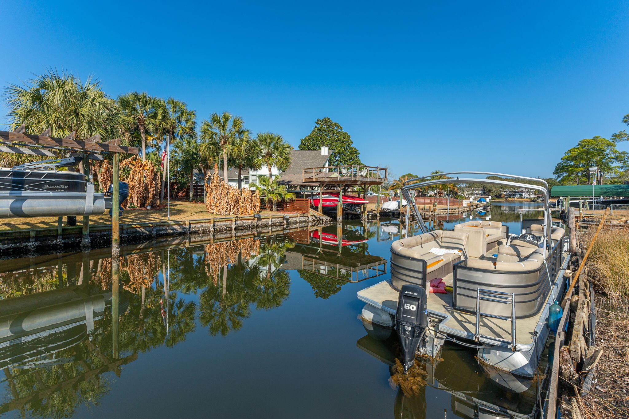 Nestled along the tranquil shores of Good Thing Lake in the sought-after Elliott Point area, this charming home boasts 3 bedrooms and 1 bathroom, blending classic appeal with some modern updates. A large wood deck stretches out, offering stunning views of the nearly half-acre property, which sits on a peaceful canal. Within minutes, you'll be cruising into the expansive Choctawhatchee Bay.The home features a cozy Florida room that invites you to soak in the beauty of the water, perfect for watching the sunset or enjoying a quiet morning. The kitchen has been thoughtfully updated over the years, maintaining its original charm while adding modern conveniences. Similarly, the bathrooms have seen tasteful renovations, offering both style and functionality. The dining area with a beautiful built in china cabinet offers views of the great room to the water as well as opening to the living room creating a perfect flow for entertaining family and friends. 

The kitchen has been tastefully updated with warm maple cabinets and corian counter tops to maintain the charm of this charming waterfront home. 

Homes like this, with such character and an unbeatable location in the highly desirable Elliott Point neighborhood, are a rare find at this price. This property offers the perfect blend of old-world charm and modern comforts, making it an ideal retreat for those seeking a serene lakeside lifestyle. 

*DETAILS*
Whole house generator - Generac ( just inspected ) -
Roof- 2022
HVAC- 2023 ( transferable maintenance plan) 
Hot Water Heater ( gas) - 2020
Survey available